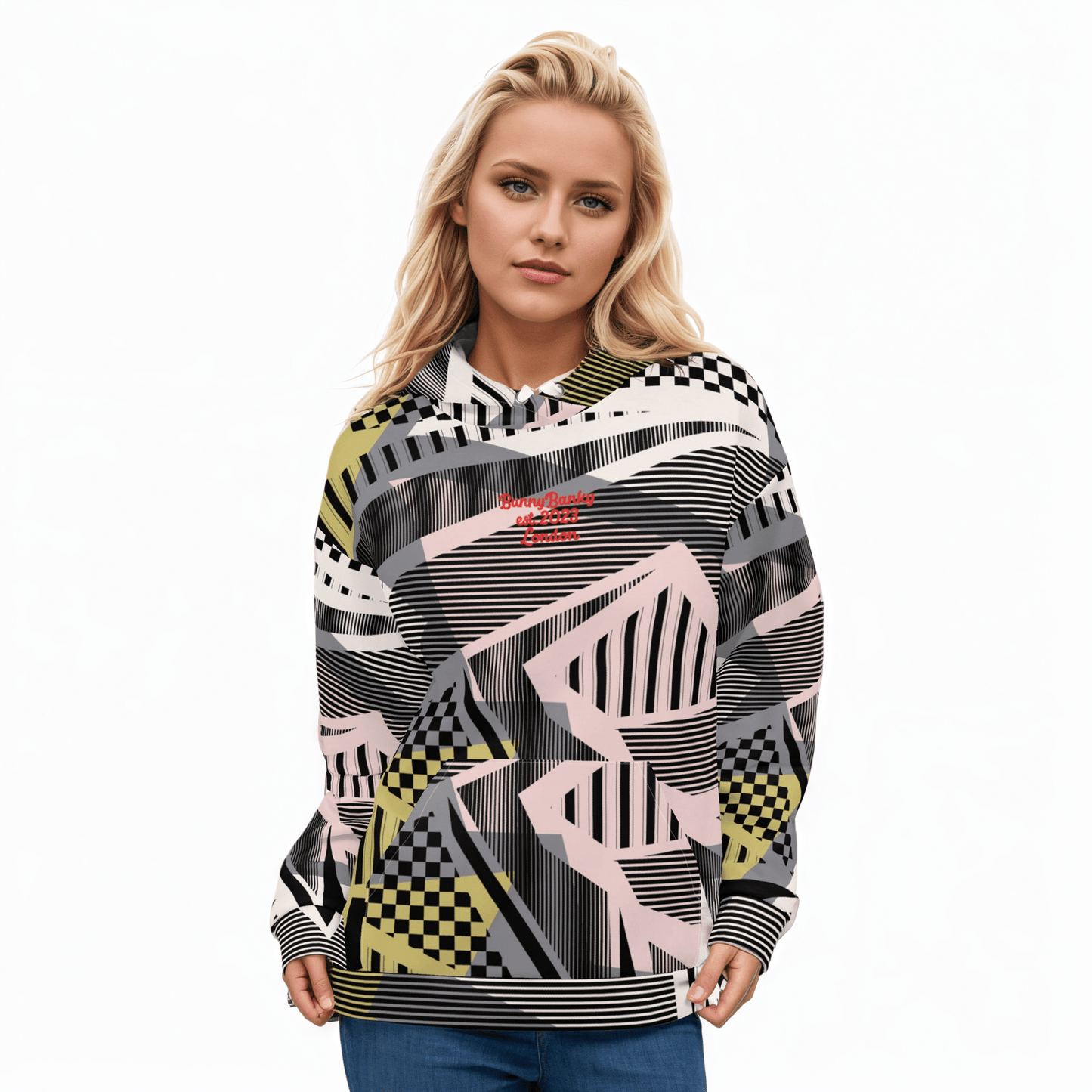 A BunnyBankY AI proprietary model wearing the Miami Resort Hoodie. The image highlights the Art Deco-inspired pattern of checkers and pinstripes in soft pink, sand, and olive tones, featuring red London branding.