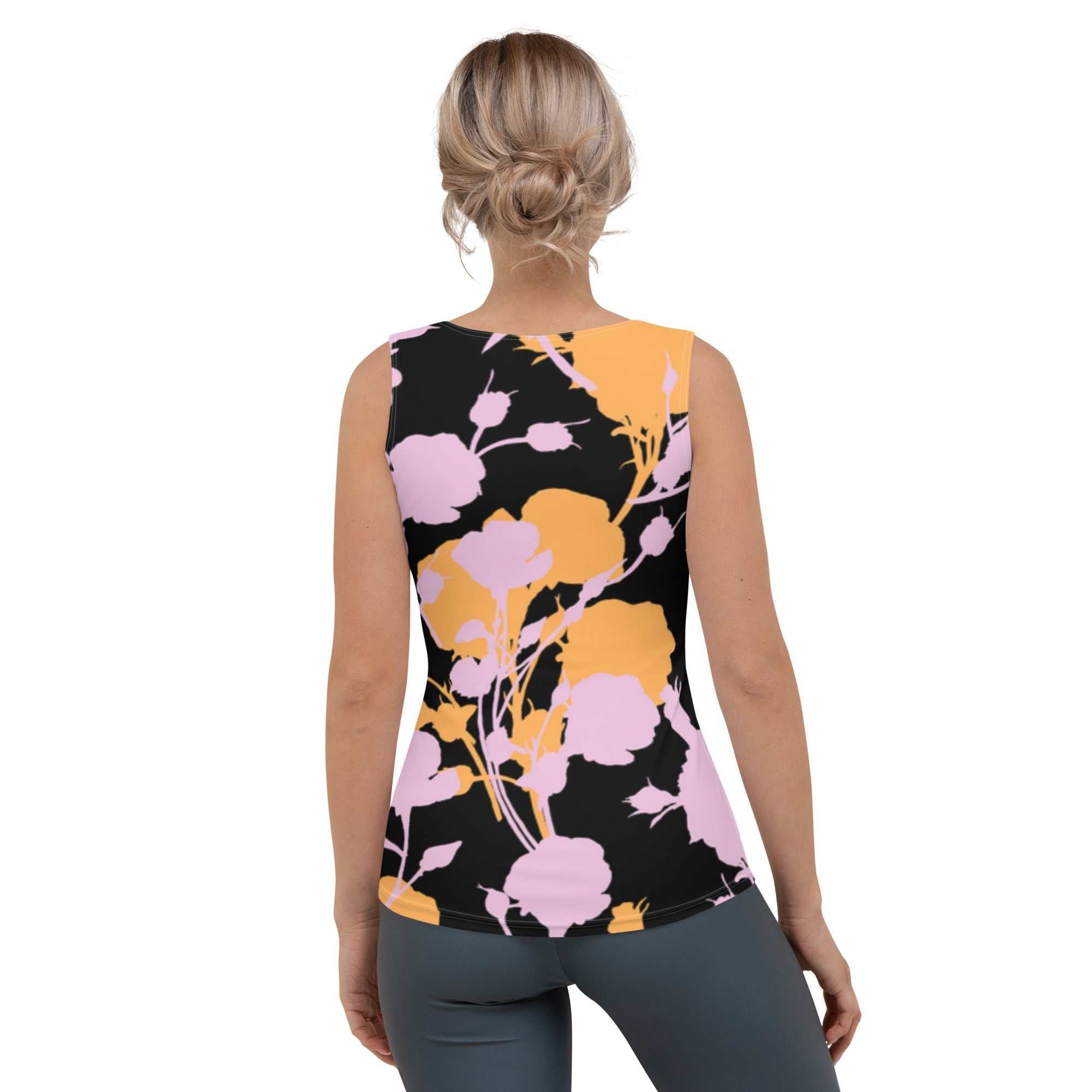 A model wearing The Miami Performance Tank, showing the second-skin fit and the dynamic pink and orange splashes print.