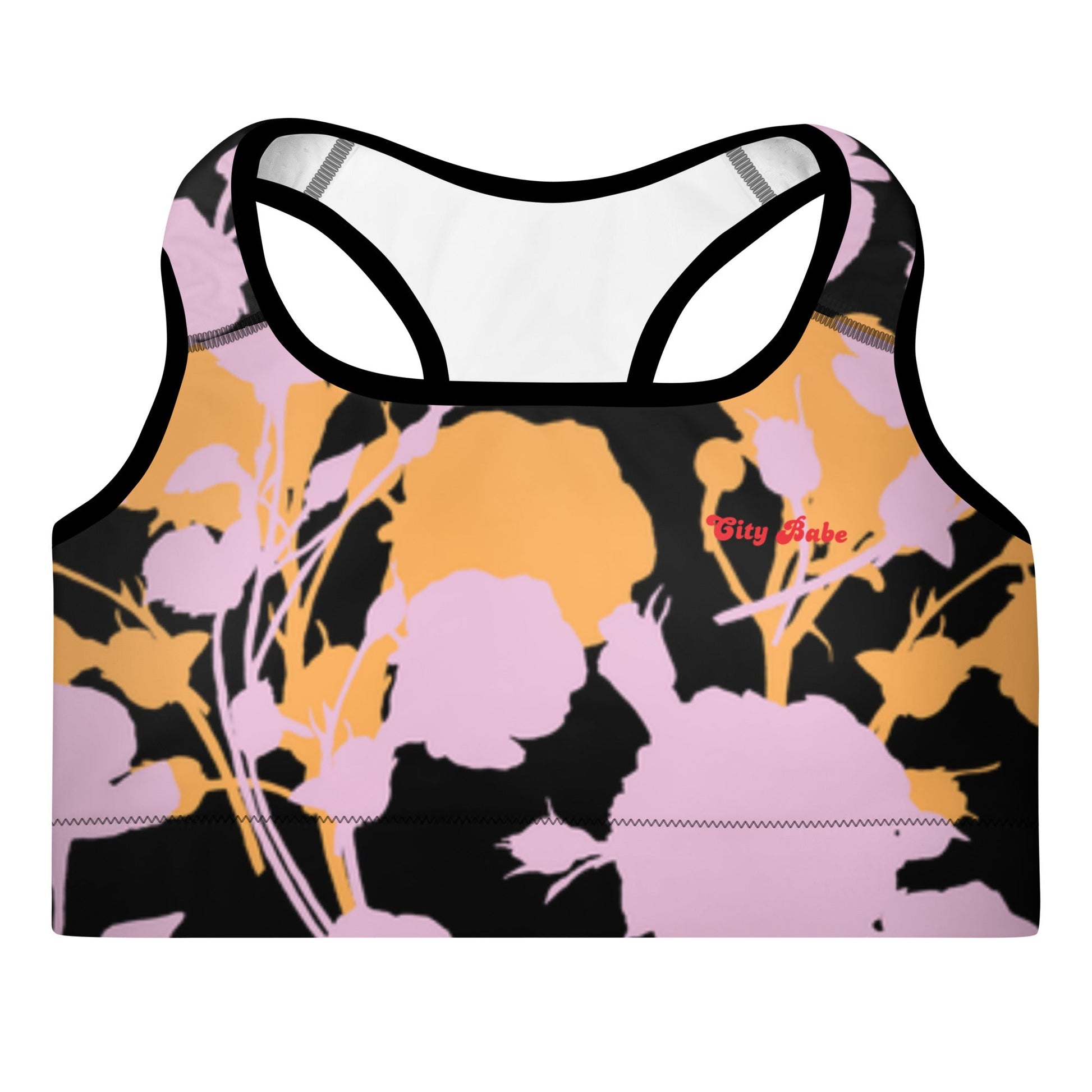 A close up of The Miami Performance Bra, showing the supportive fit and the vibrant pink and orange splashes print.