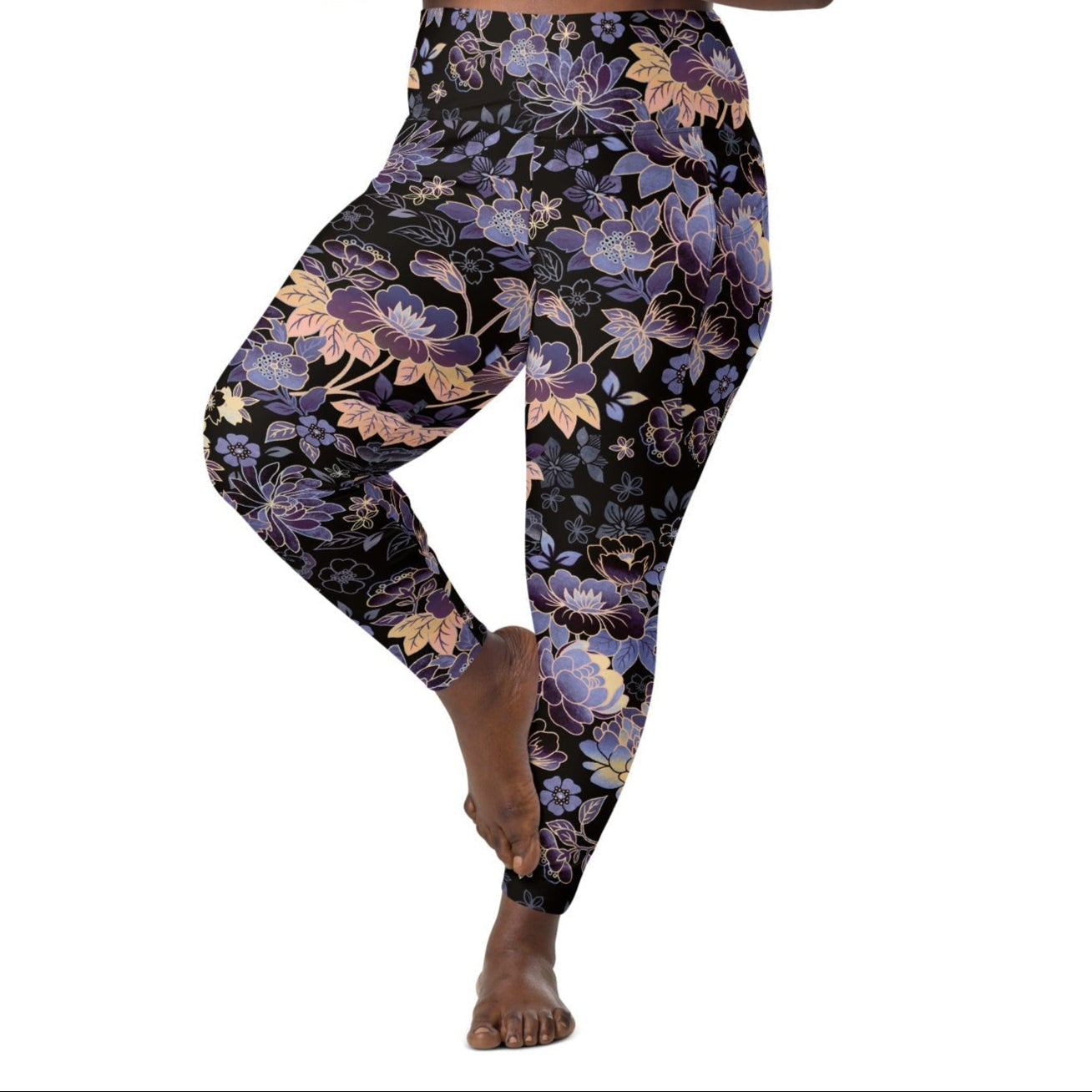 Model wearing the Milano sculpt leggings in purple and beige floral pattern on a black fabric.