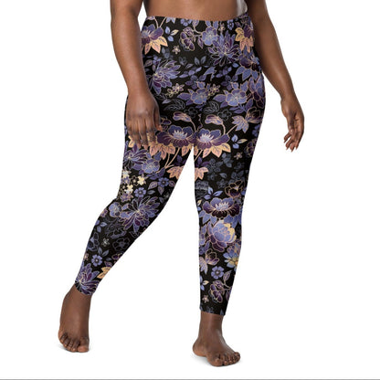 Model wearing the Milano sculpt leggings in purple and beige floral pattern on a black fabric.