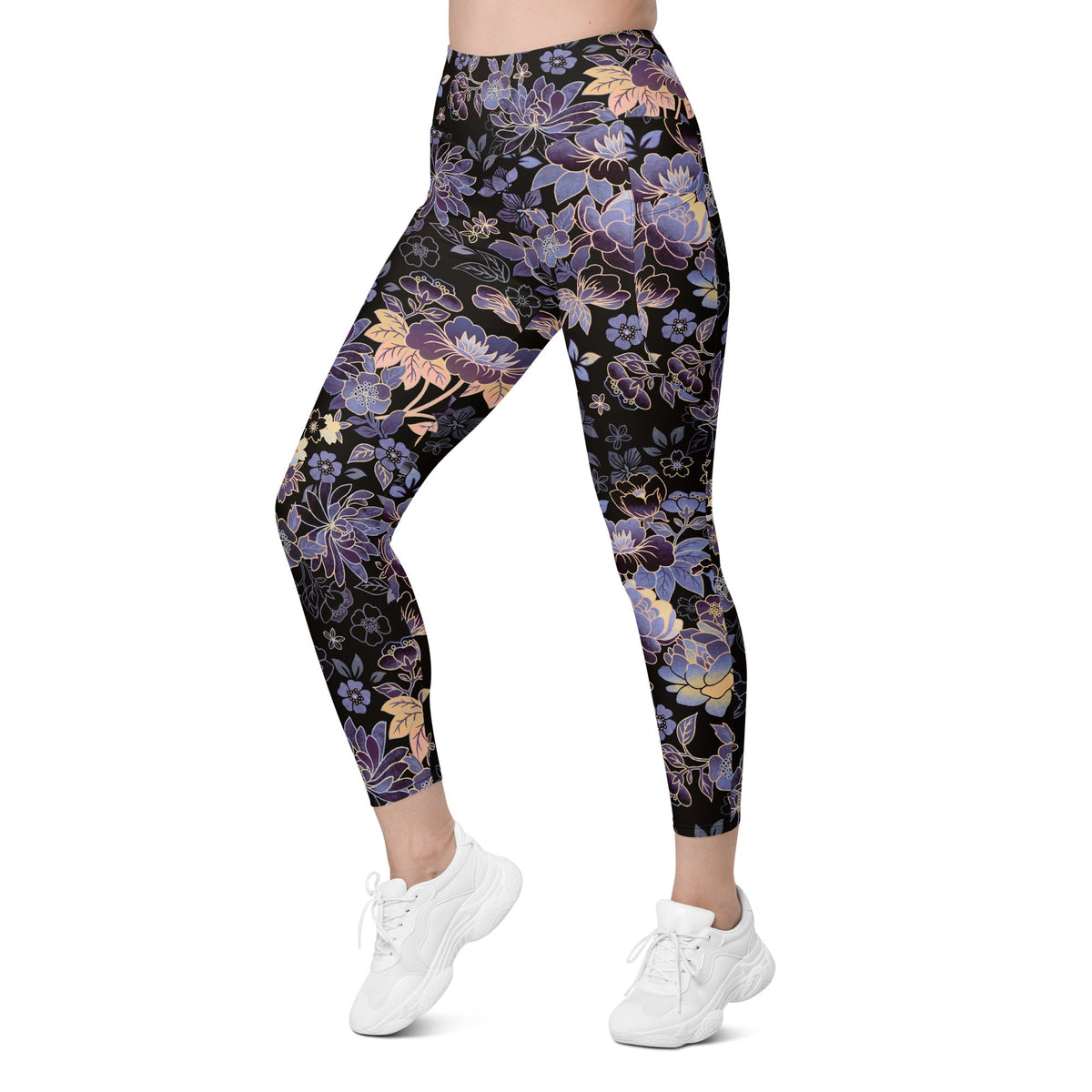 Model wearing the Milano sculpt leggings in purple and beige floral pattern on a black fabric.