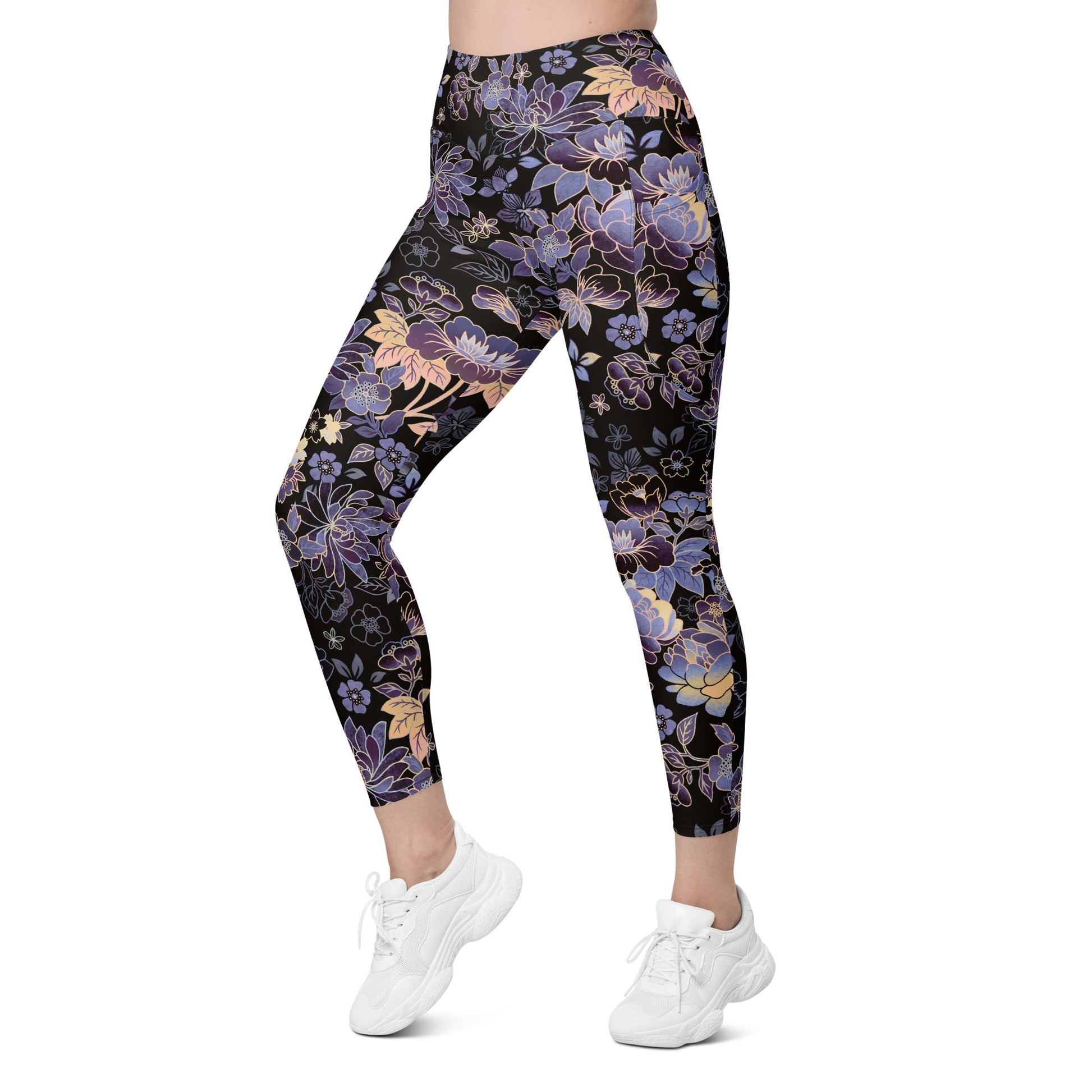 Model wearing the Milano sculpt leggings in purple and beige floral pattern on a black fabric.