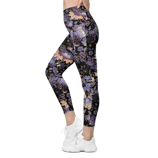 Model wearing the Milano sculpt leggings in purple and beige floral pattern on a black fabric.