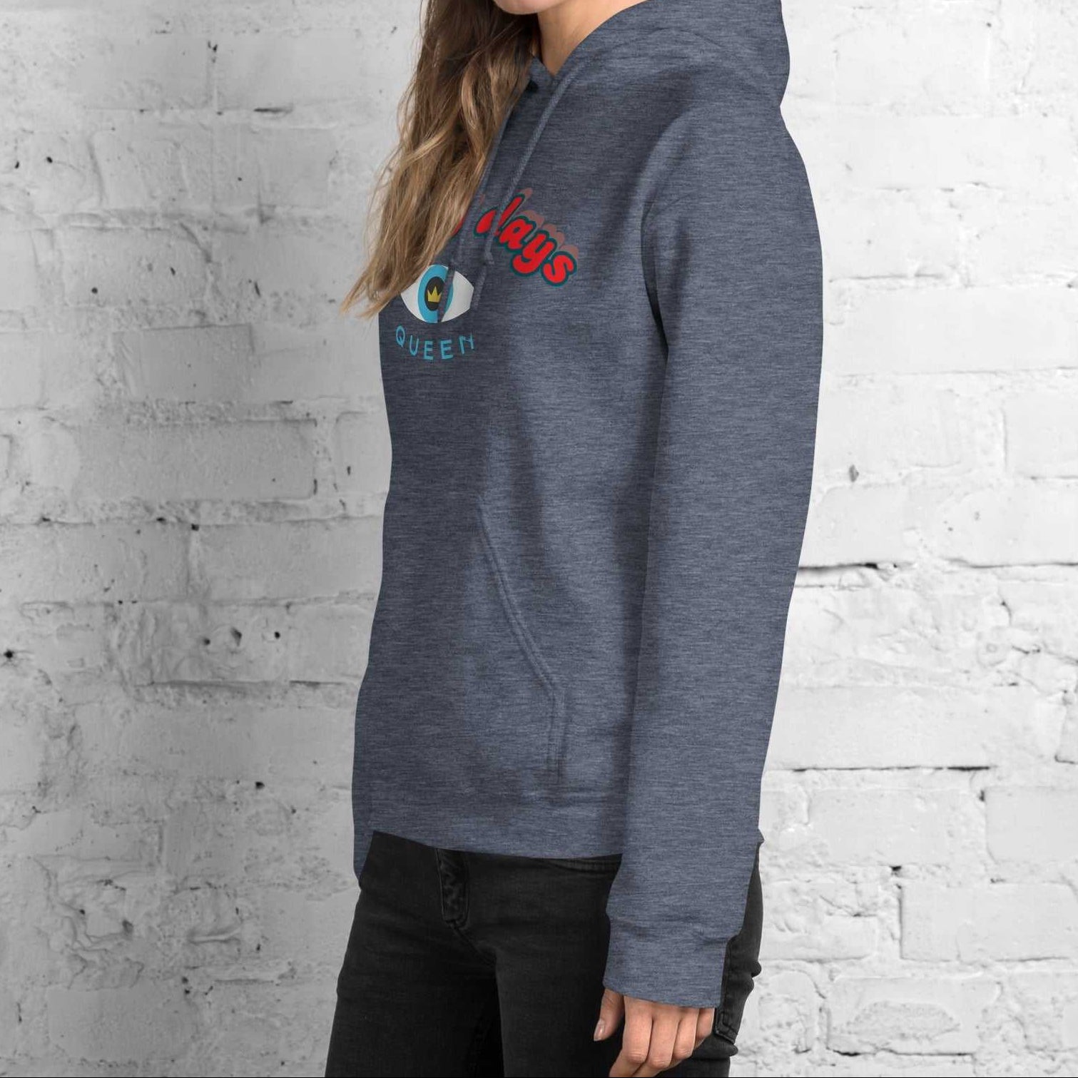 A model wearing The Mykonos Hoodie, showing the relaxed fit, drawstring hood, and the  Crown and 