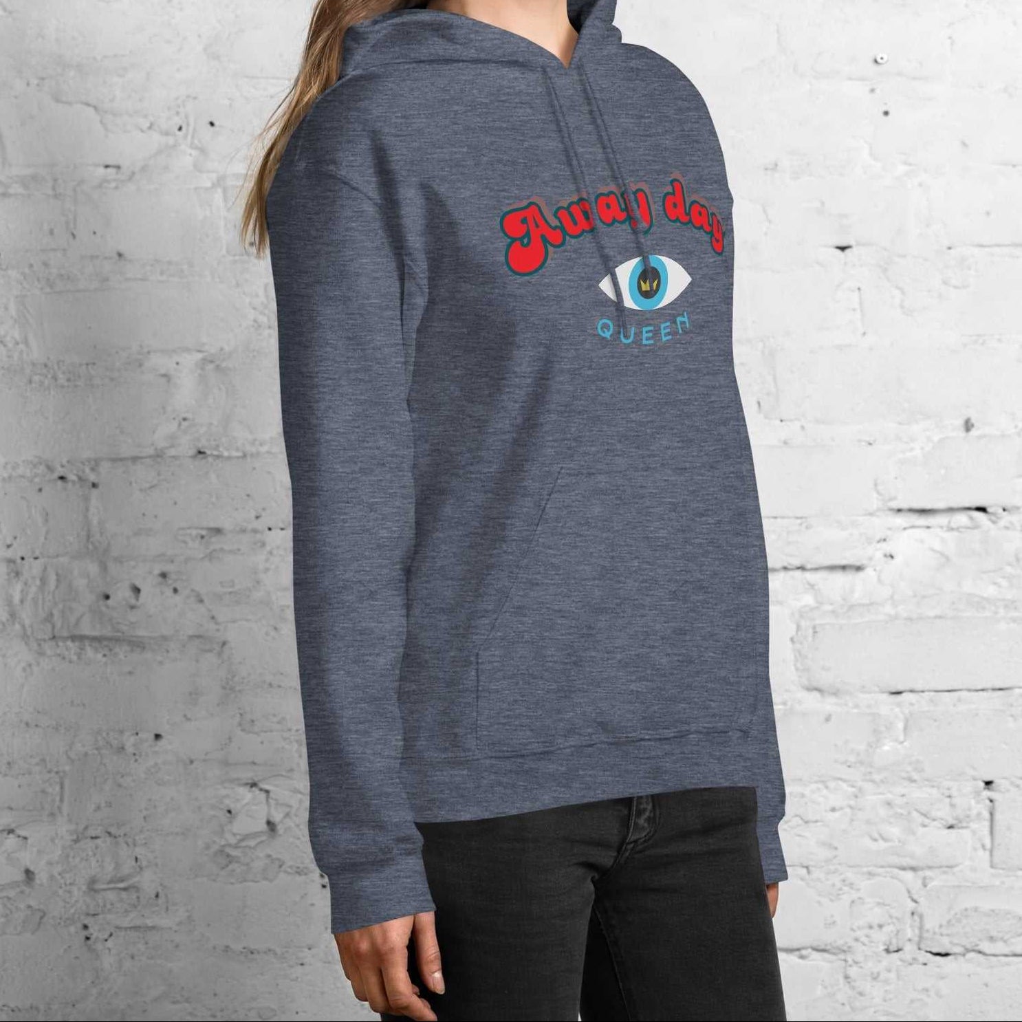 A model wearing The Mykonos Hoodie, showing the relaxed fit, drawstring hood, and the  Crown and 