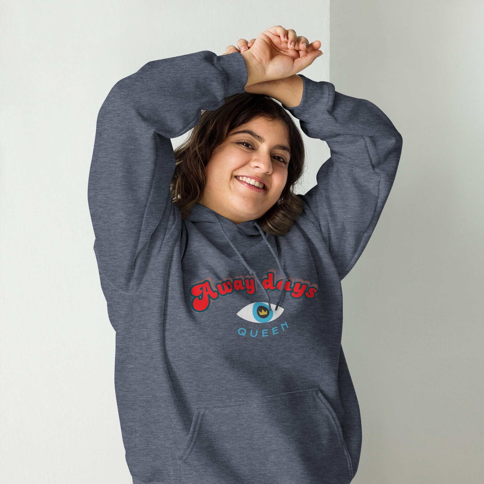 A model wearing The Mykonos Hoodie, showing the relaxed fit, drawstring hood, and the  Crown and "Queen" print on the front center.