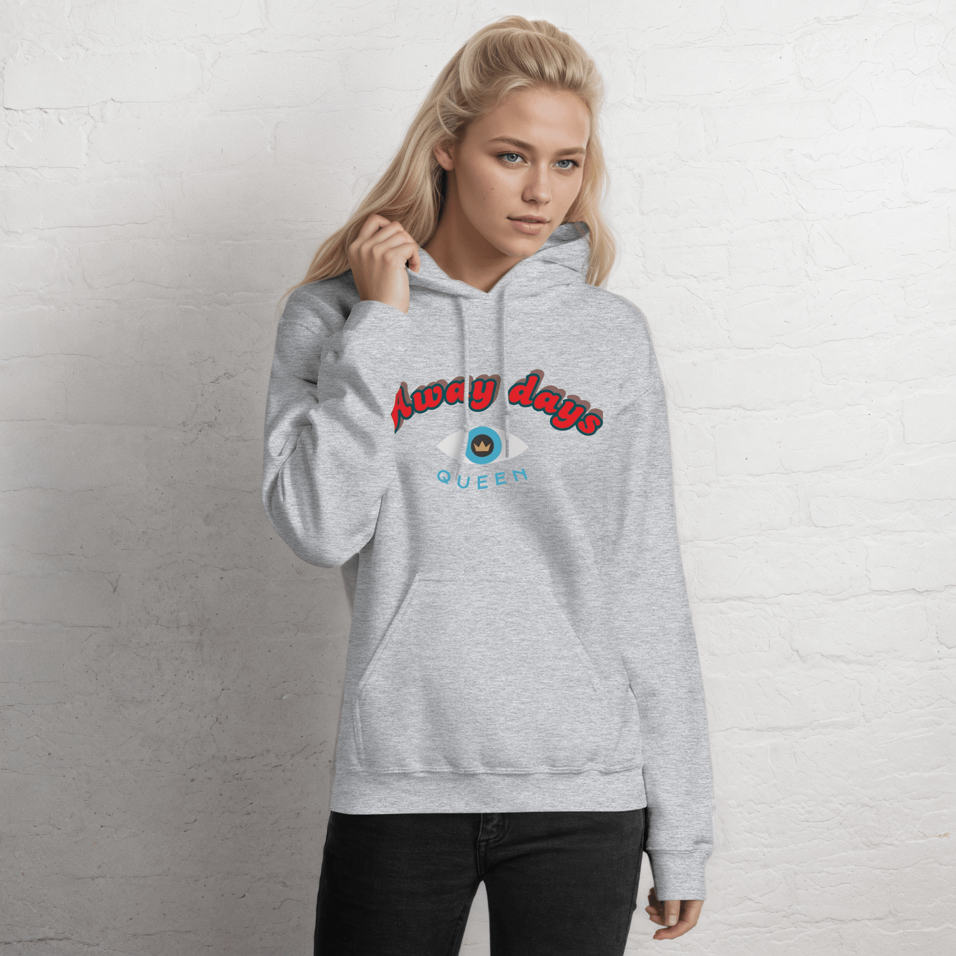 A model wearing The Mykonos Hoodie, showing the relaxed fit, drawstring hood, and the  Crown and "Queen" print on the front center.