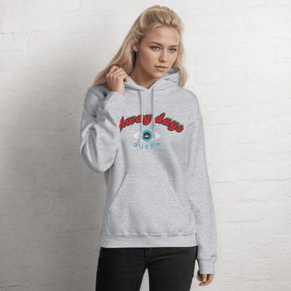 A model wearing The Mykonos Hoodie, showing the relaxed fit, drawstring hood, and the  Crown and "Queen" print on the front center.