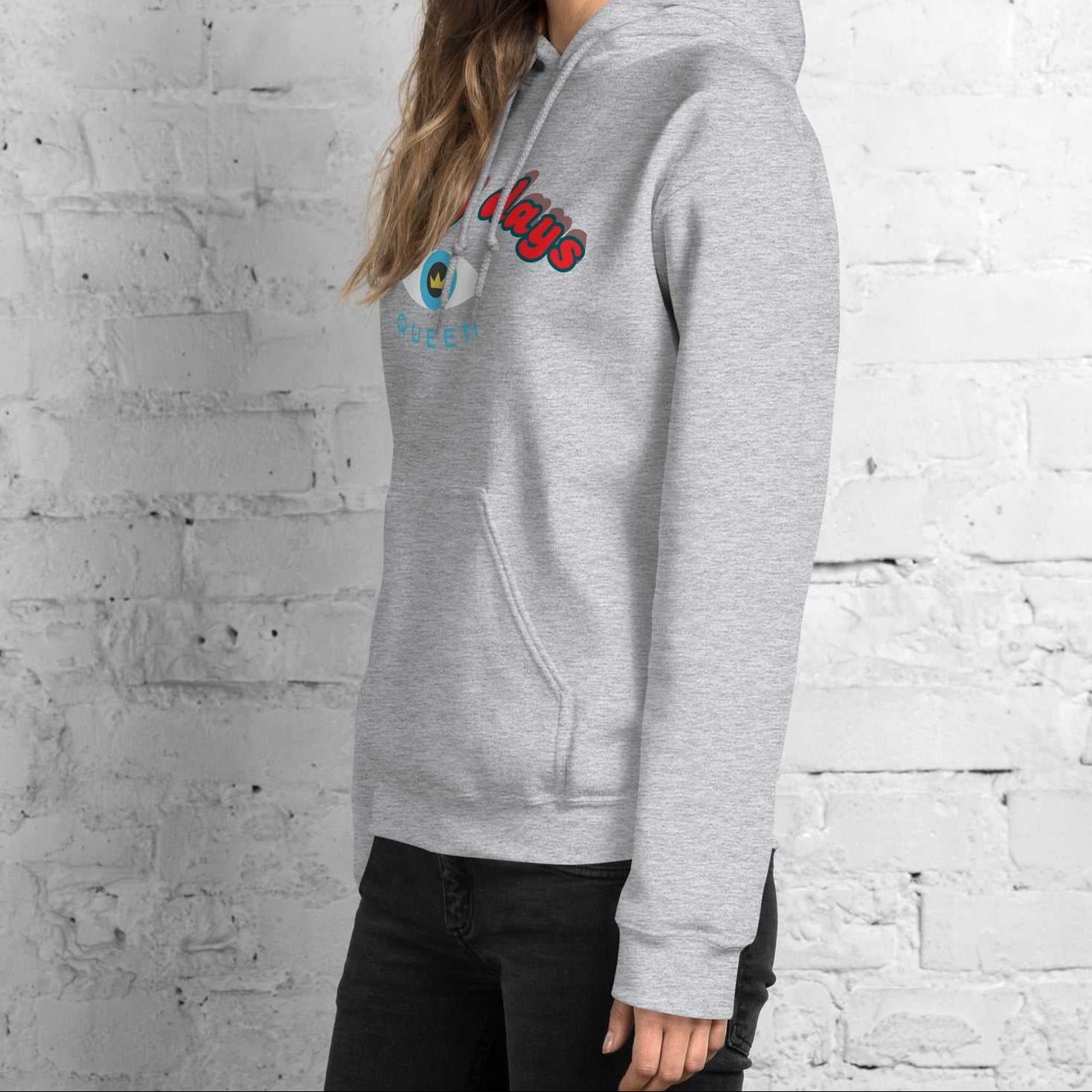 A model wearing The Mykonos Hoodie, showing the relaxed fit, drawstring hood, and the  Crown and 