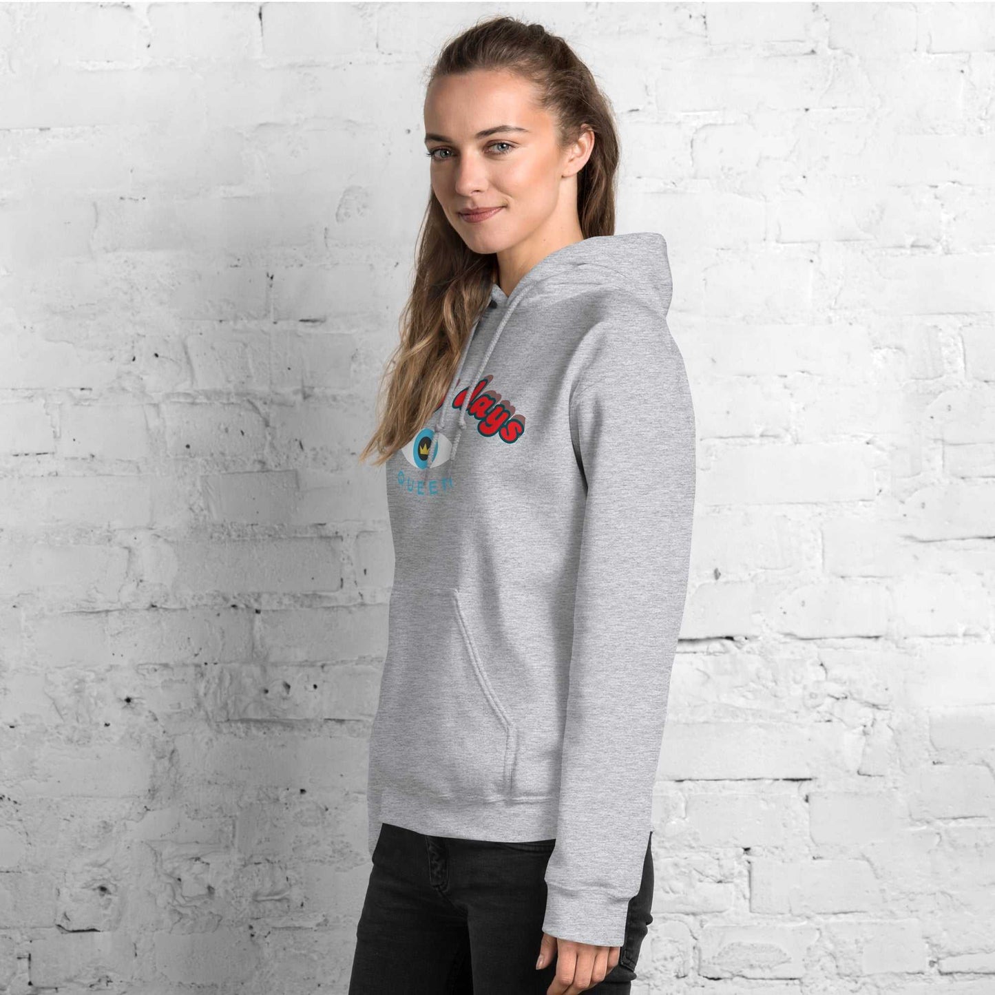 A model wearing The Mykonos Hoodie, showing the relaxed fit, drawstring hood, and the  Crown and "Queen" print on the front center.