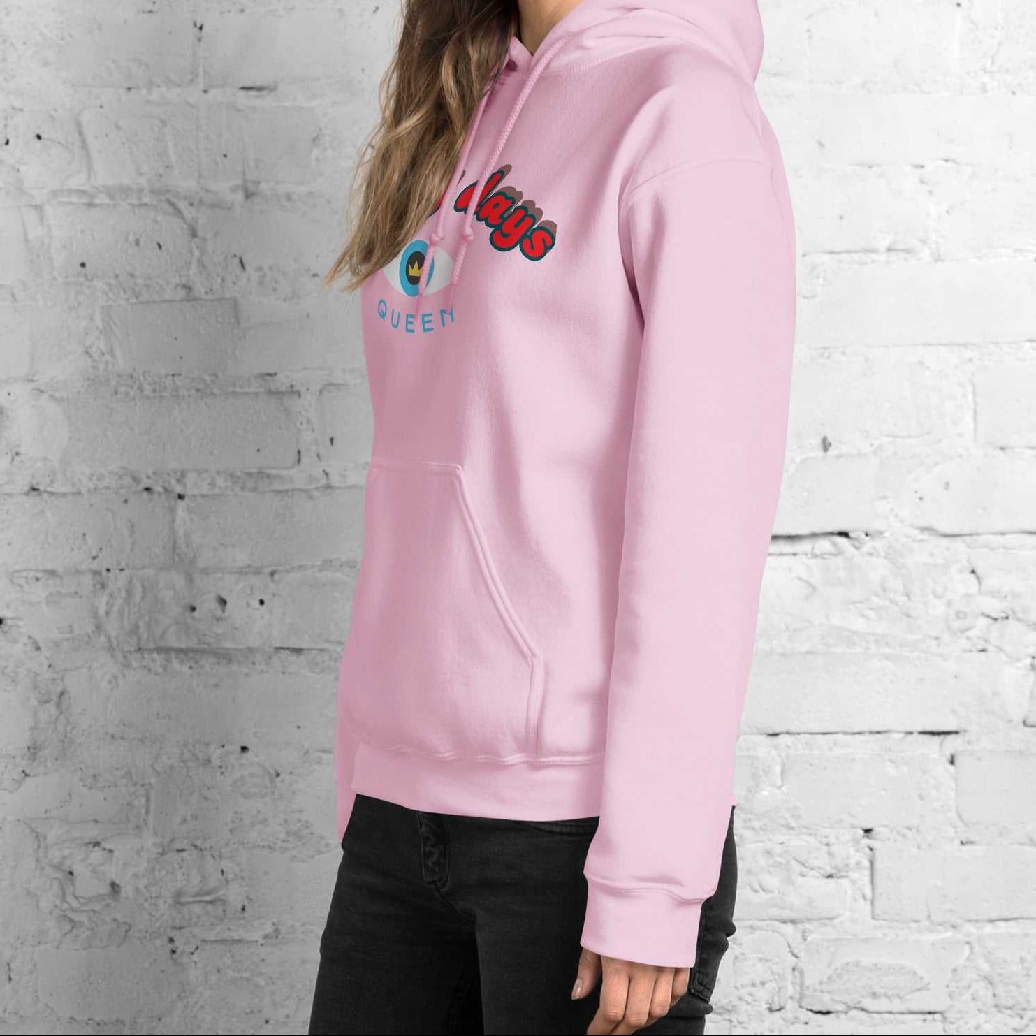A model wearing The Mykonos Hoodie, showing the relaxed fit, drawstring hood, and the  Crown and 