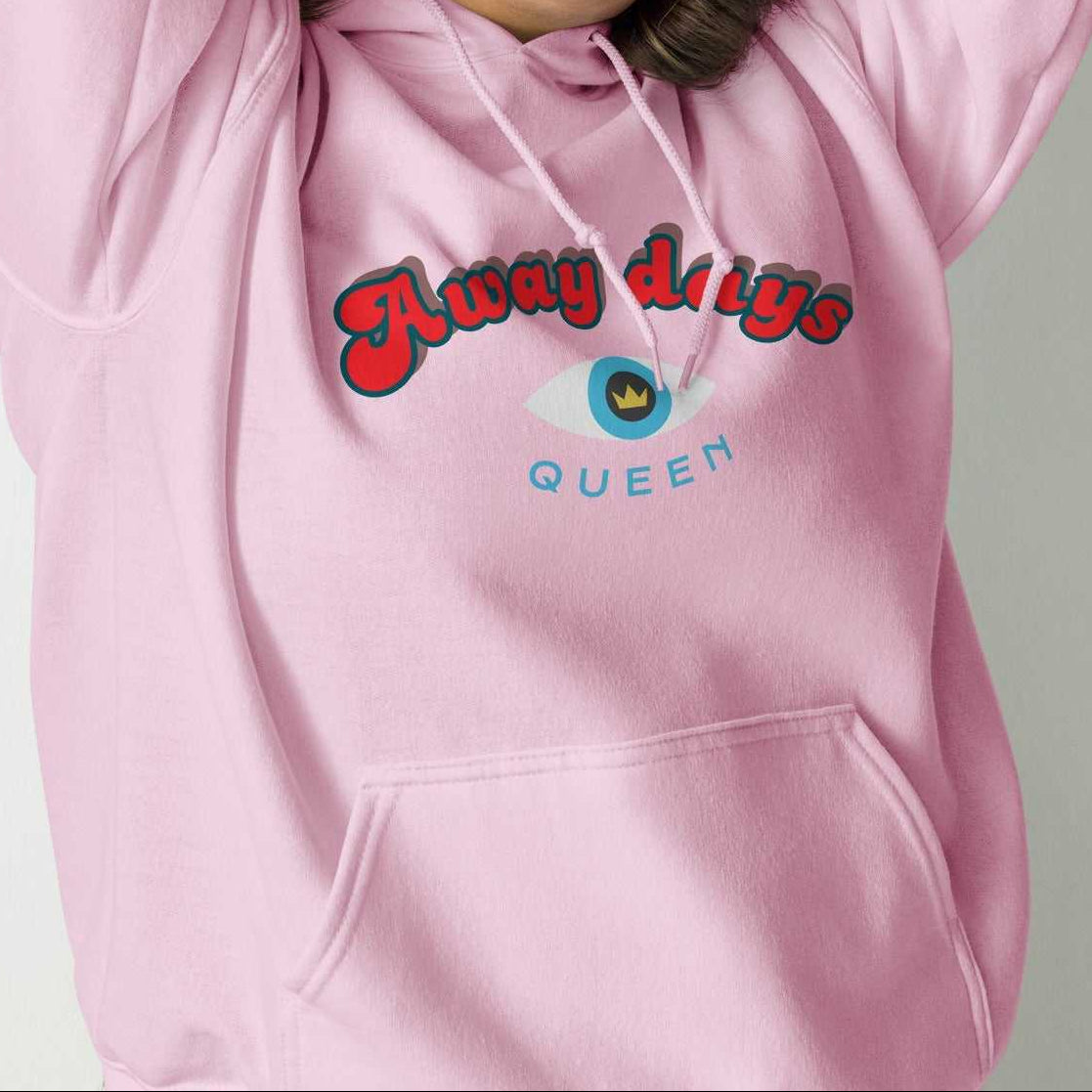 A model wearing The Mykonos Hoodie, showing the relaxed fit, drawstring hood, and the  Crown and 