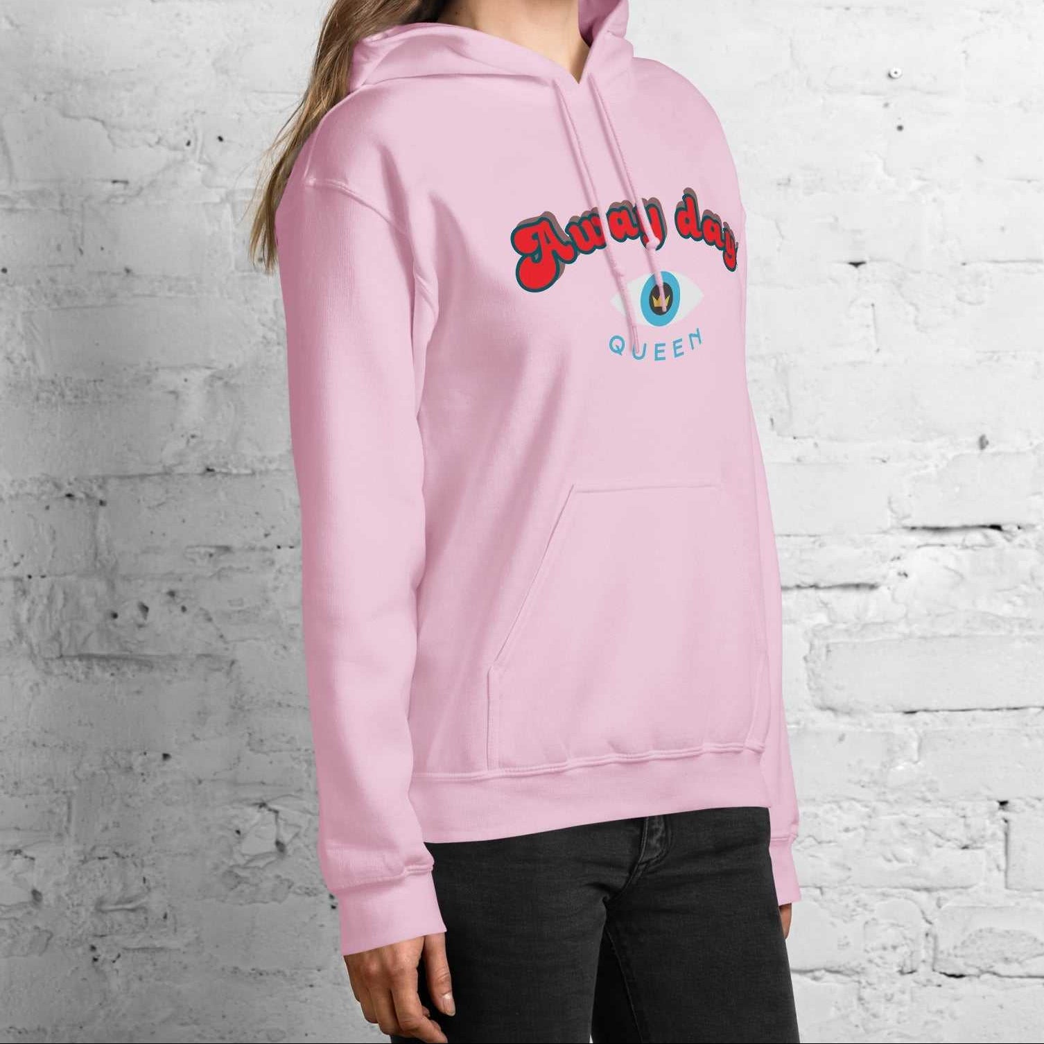 A model wearing The Mykonos Hoodie, showing the relaxed fit, drawstring hood, and the  Crown and 