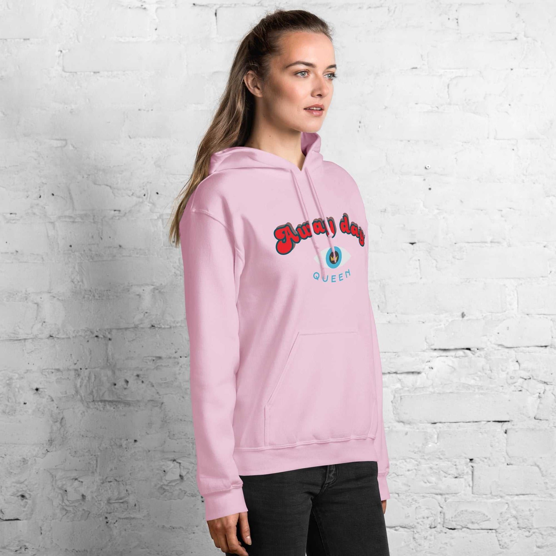 A model wearing The Mykonos Hoodie, showing the relaxed fit, drawstring hood, and the  Crown and "Queen" print on the front center.