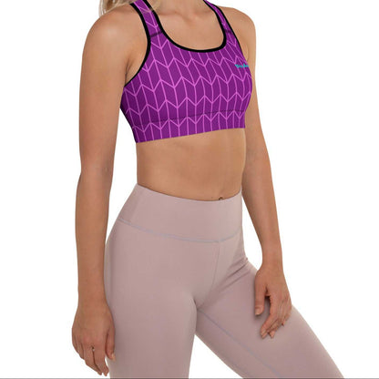 A close-up of The New York Performance Bra, showing the "City Babe" text on the purple Art Deco print.