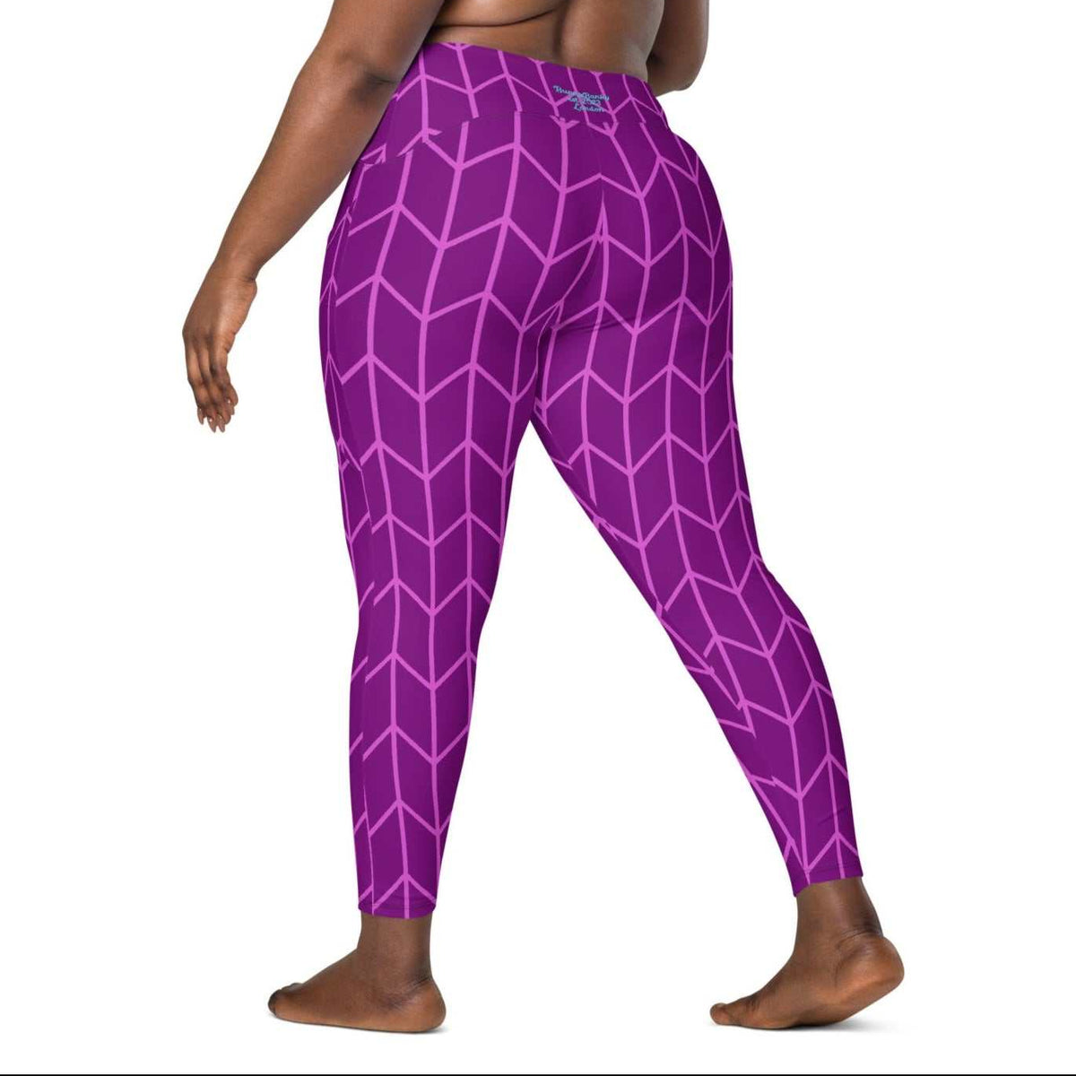 model wearing the New York sculpt leggings featuring a lilac geometric pattern on purple fabric.