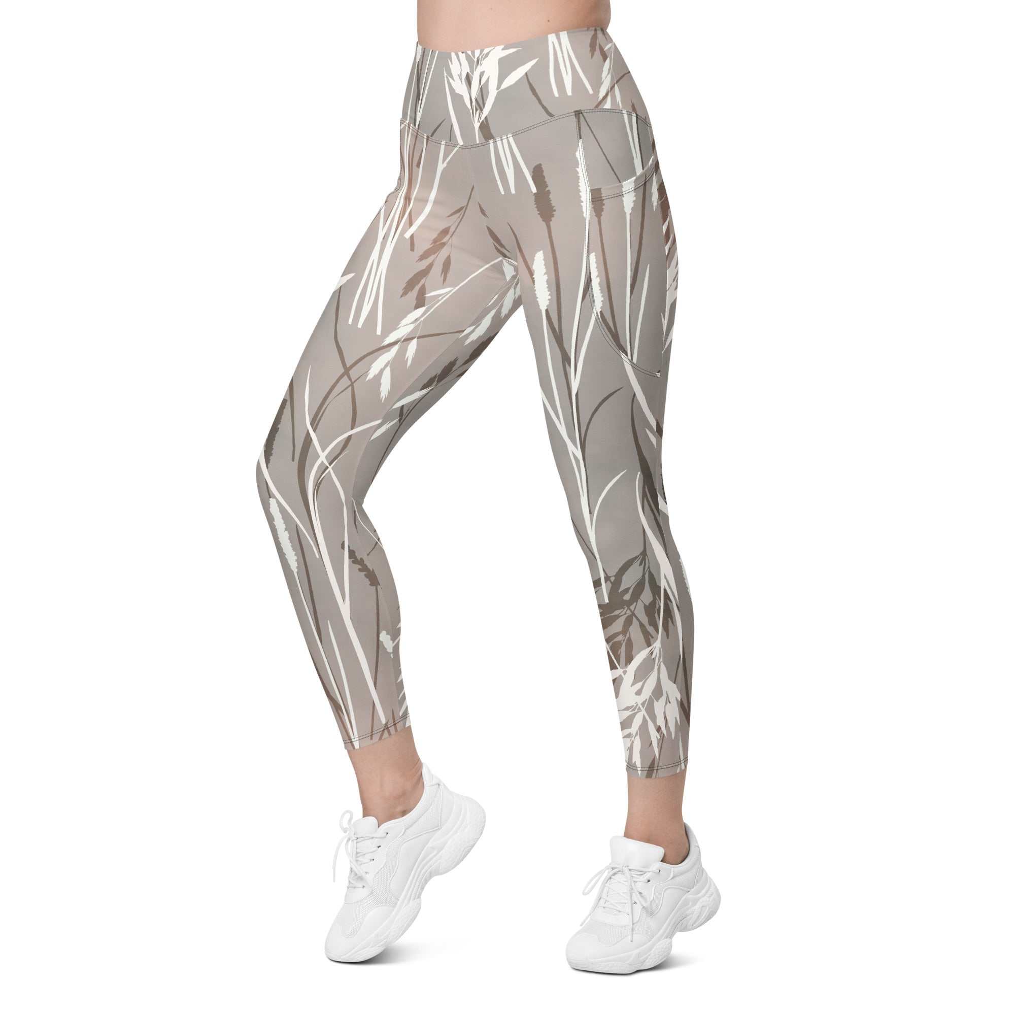 The Osaka Sculpt Leggings in light grey beige with earthy floral brush strokes, high-waisted, soft stretch fabric, dual side pockets, and UPF 50+ sun protection.