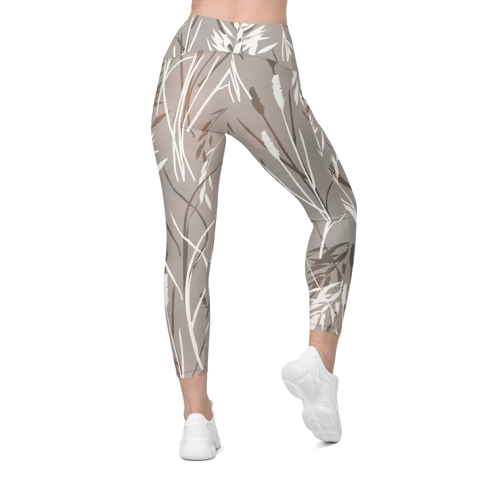 The Osaka Sculpt Leggings in light grey beige with earthy floral brush strokes, high-waisted, soft stretchy fabric, mild compression, dual side pockets, and UPF 50+ sun protection.