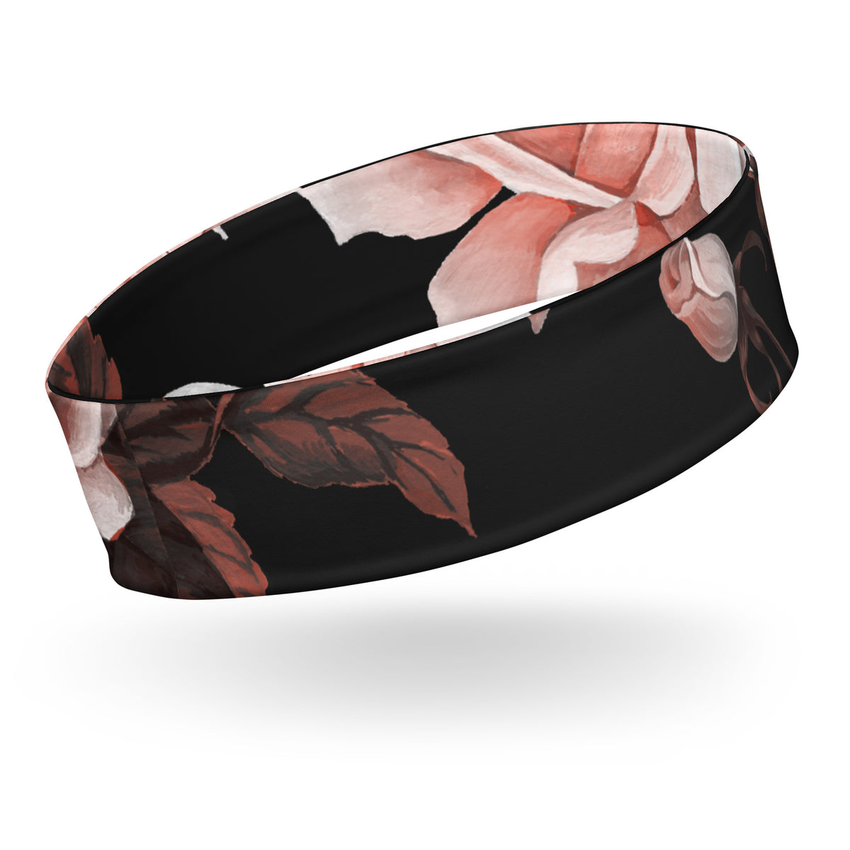 The Paris headband is an elastic featuring a floral print with pale pink and white flowers on a solid black background.