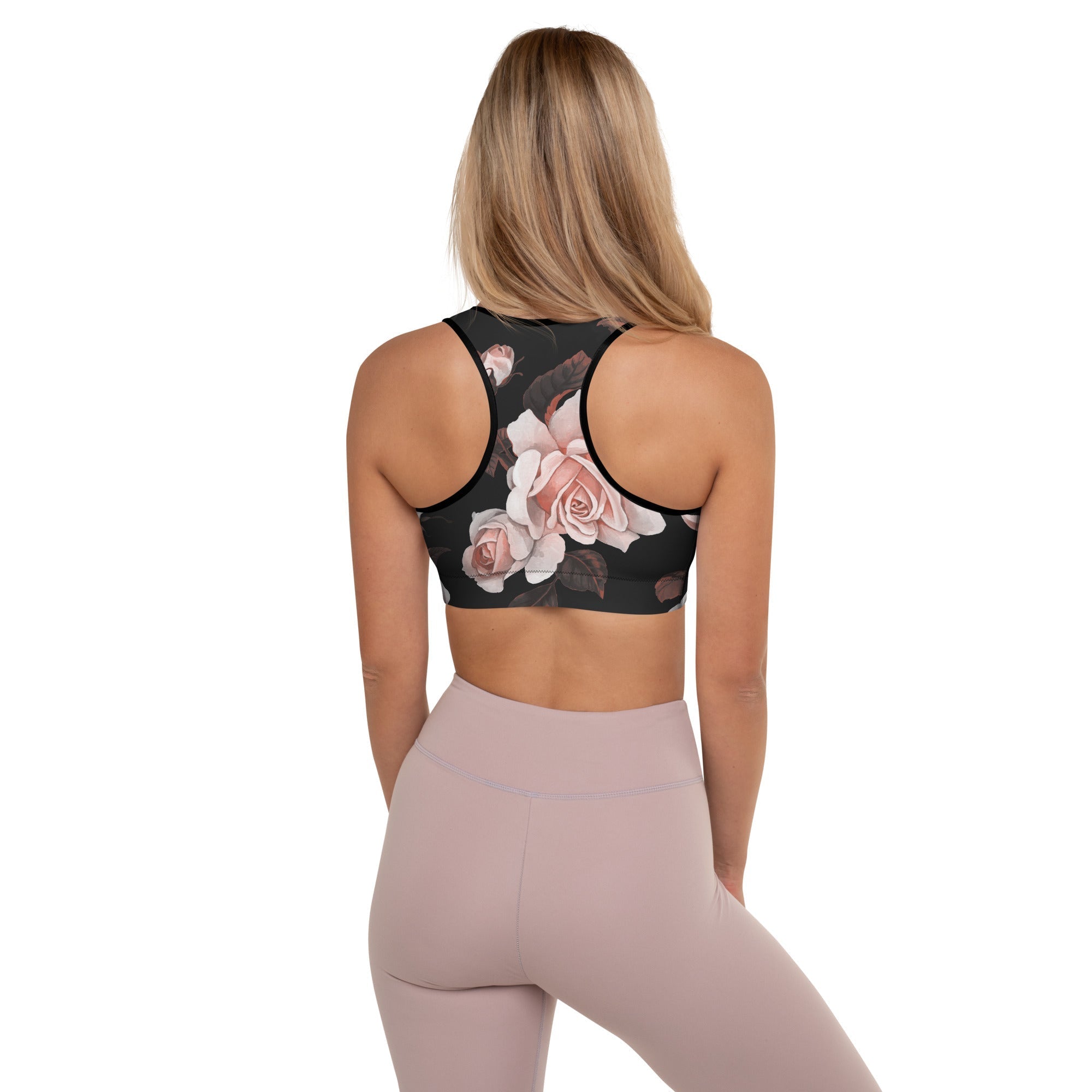 A model wearing The Paris Performance Bra, showing the racer back and the dramatic XL pale pink rose print.
