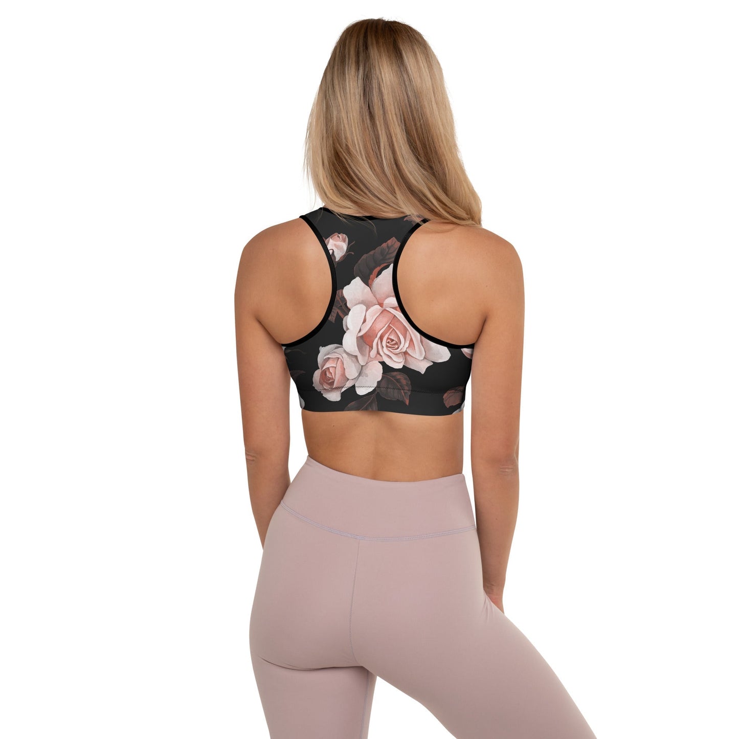 A model wearing The Paris Performance Bra, showing the racer back and the dramatic XL pale pink rose print.