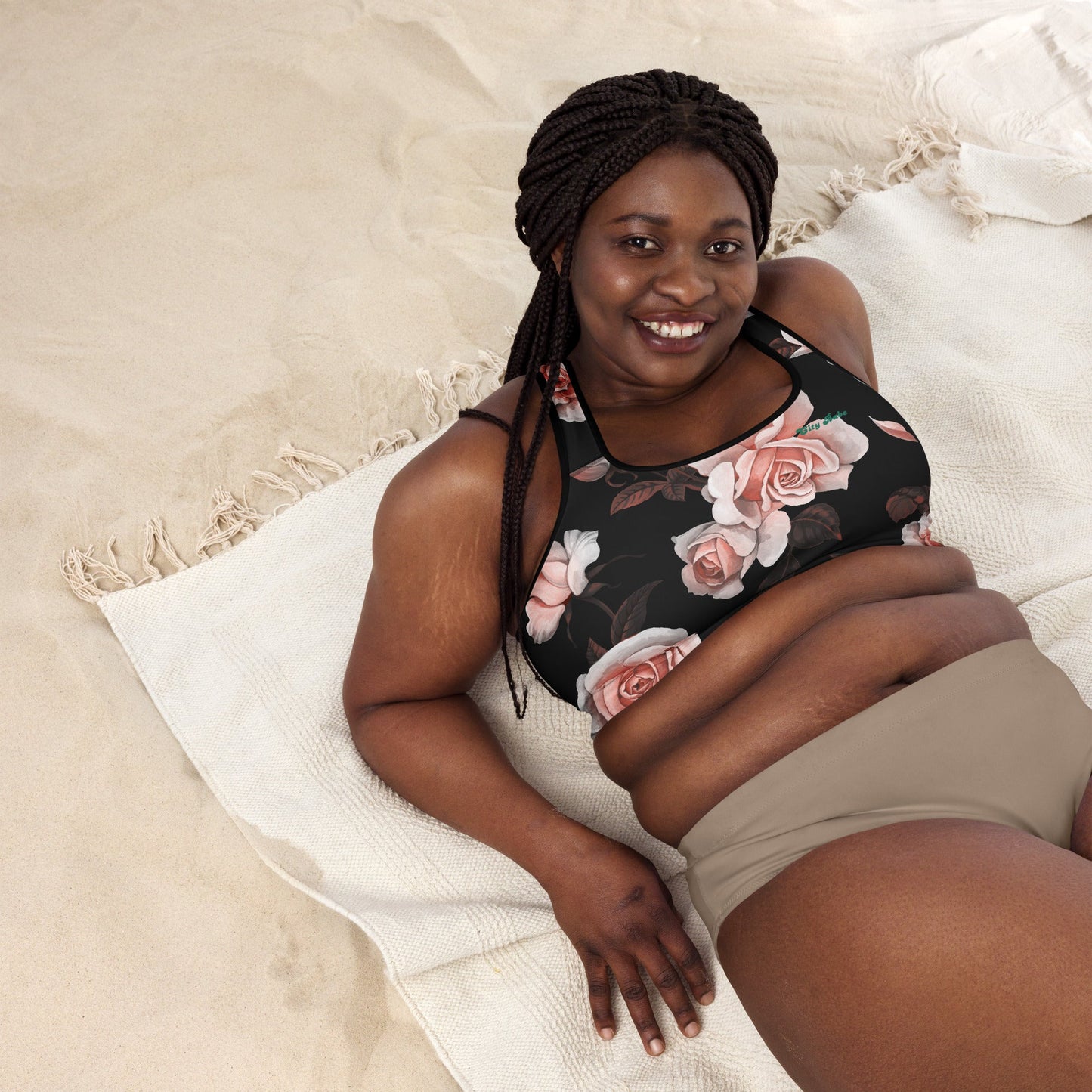 A model wearing The Paris Performance Bra, showing the wide-leg cut and the dramatic XL pale pink rose print.
