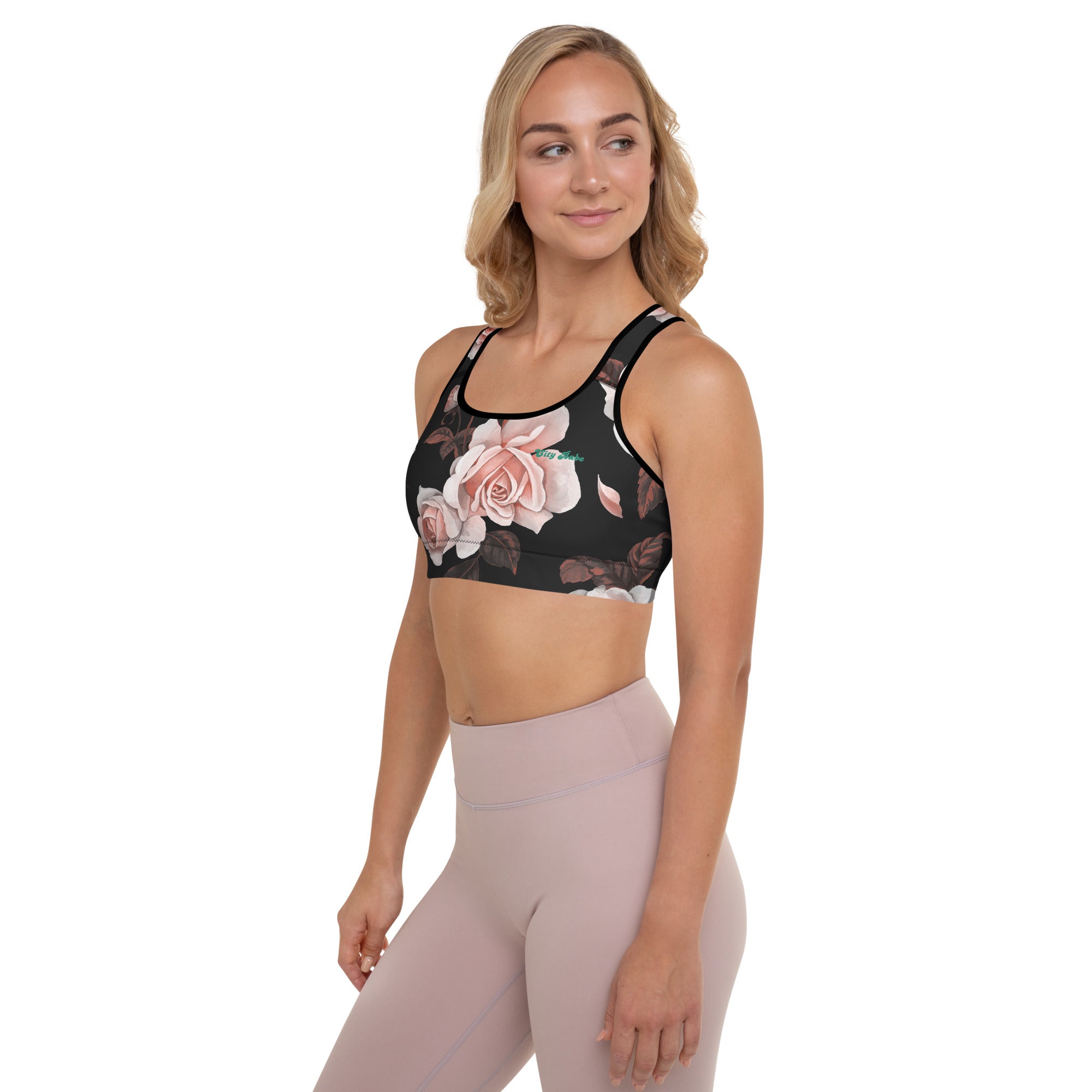 A model wearing The Paris Performance Bra, showing the wide-leg cut and the dramatic XL pale pink rose print.