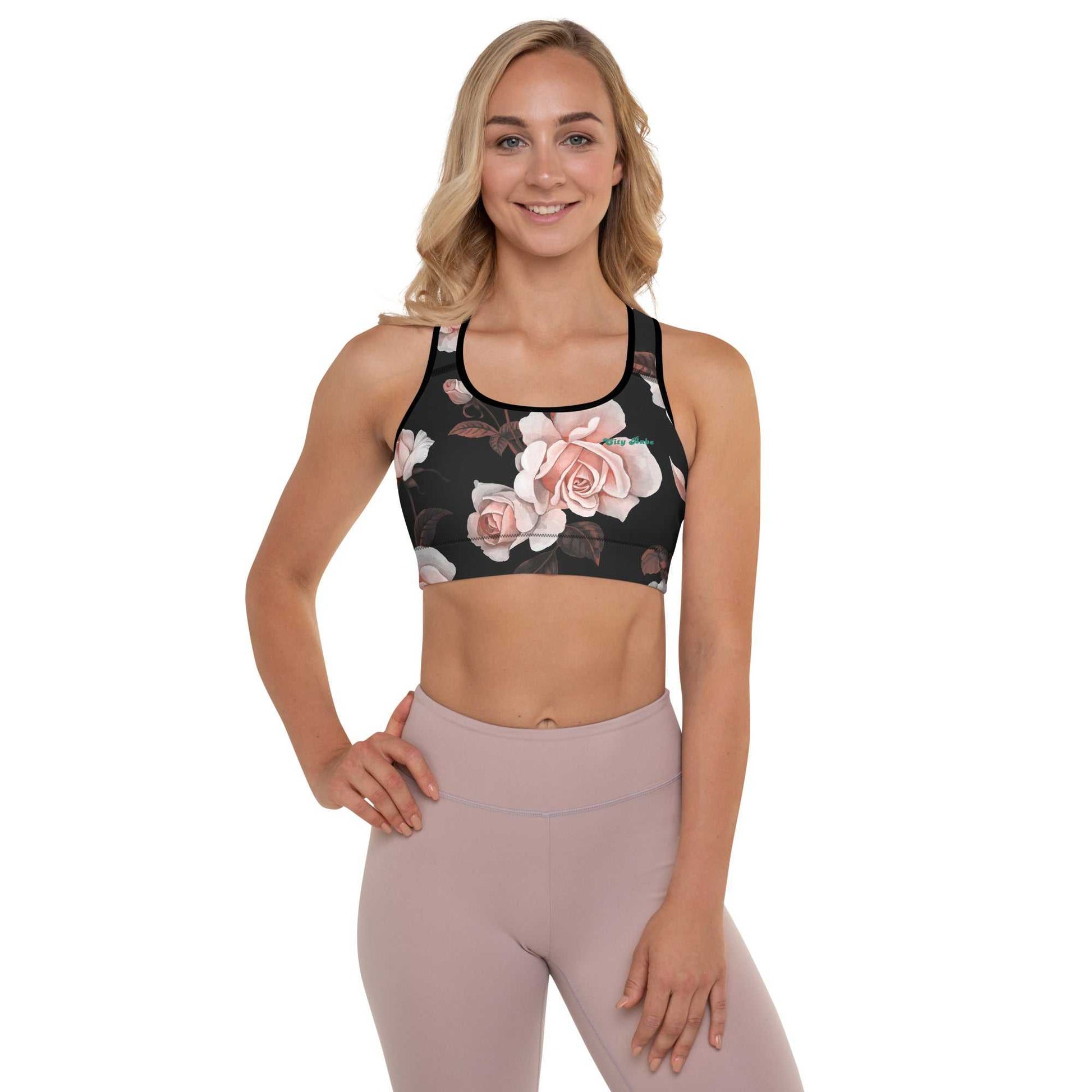 A model wearing The Paris Performance Bra, showing the wide-leg cut and the dramatic XL pale pink rose print.