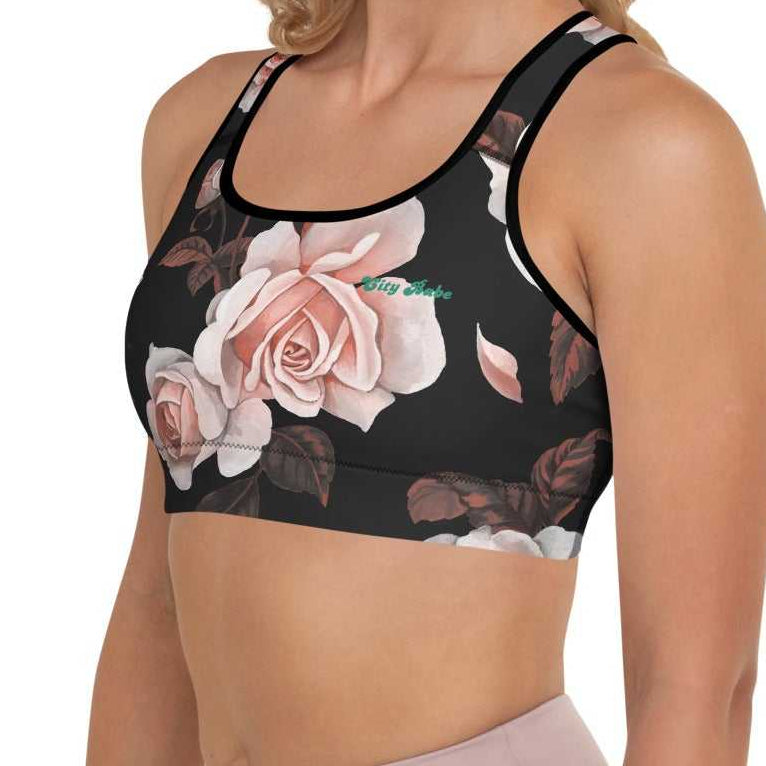 A model wearing The Paris Performance Bra, showing the wide-leg cut and the dramatic XL pale pink rose print.