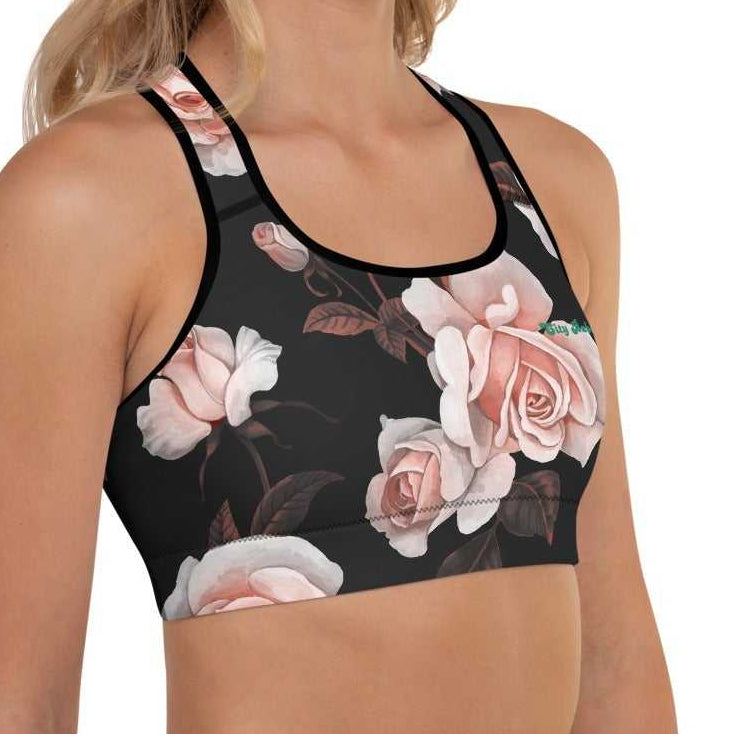 A model wearing The Paris Performance Bra, showing the wide-leg cut and the dramatic XL pale pink rose print.