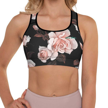 A model wearing The Paris Performance Bra, showing the wide-leg cut and the dramatic XL pale pink rose print.