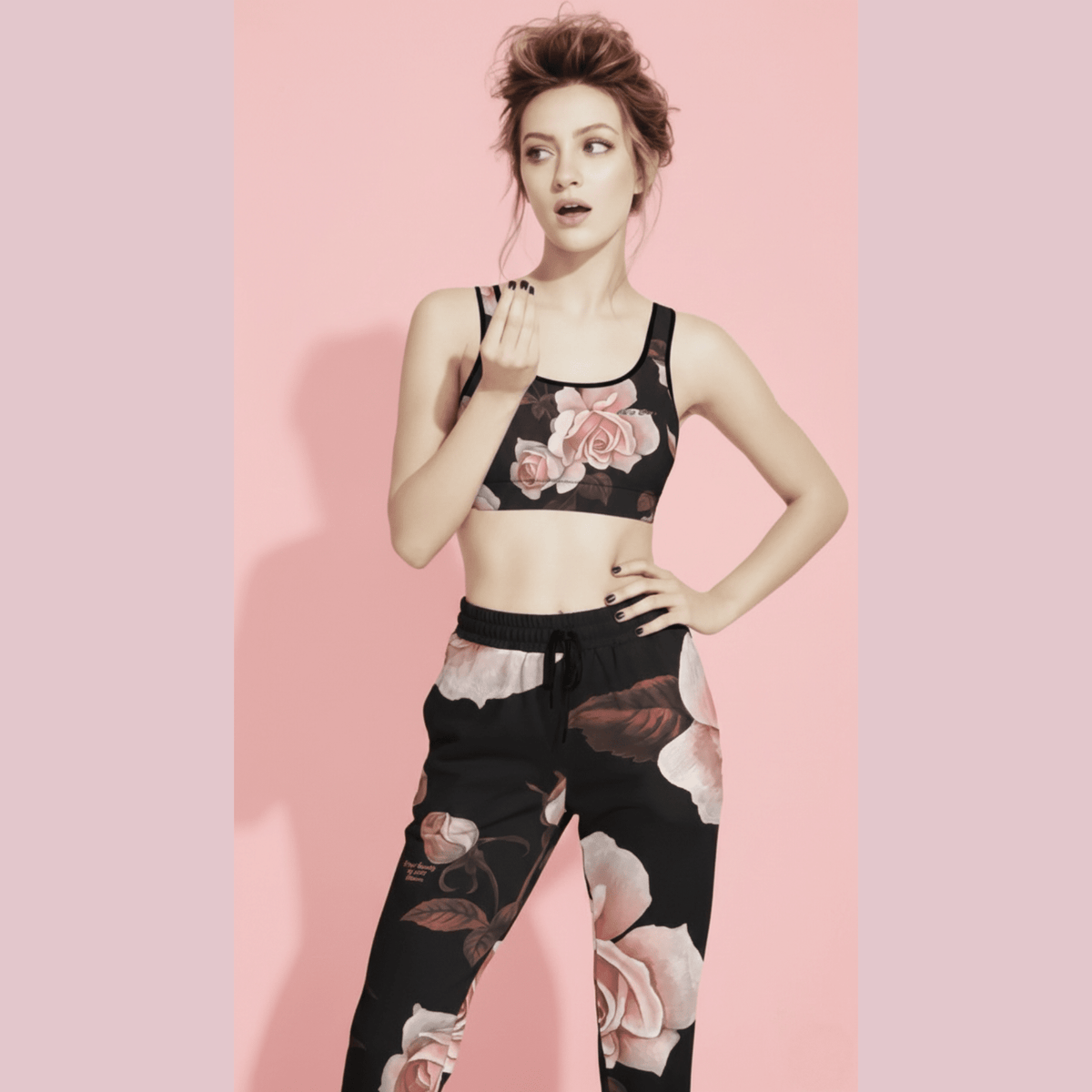 A BunnyBankY AI proprietary model wearing The Paris Performance Bra, and Paris Flow Joggers showing the movement of the fabric and the dramatic XL pale pink rose print.