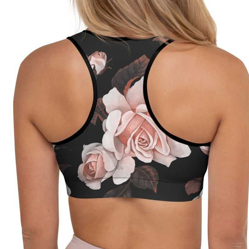 A model wearing The Paris Performance Bra, showing the racer back and the dramatic XL pale pink rose print.