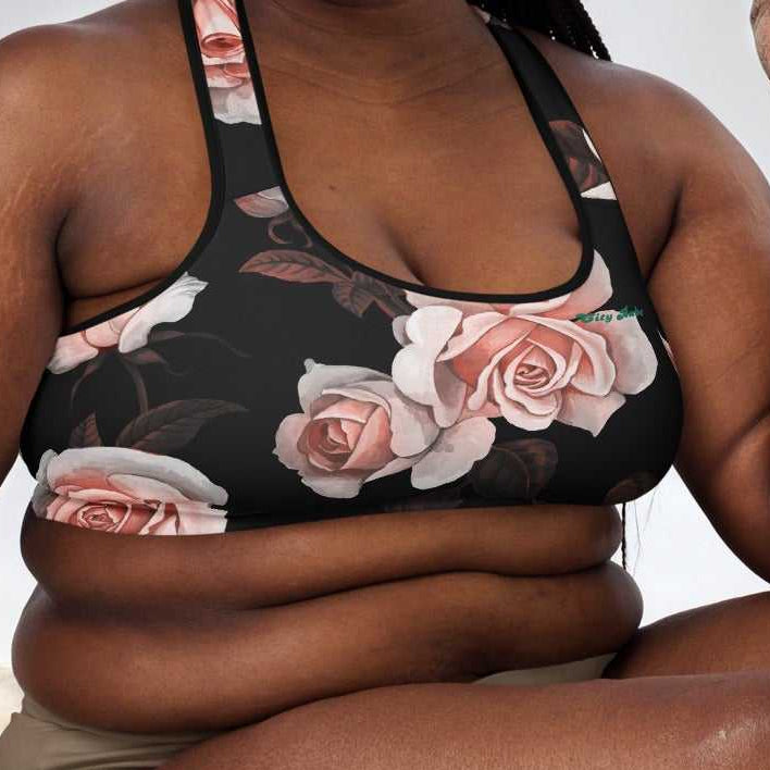 A model wearing The Paris Performance Bra, showing the wide-leg cut and the dramatic XL pale pink rose print.