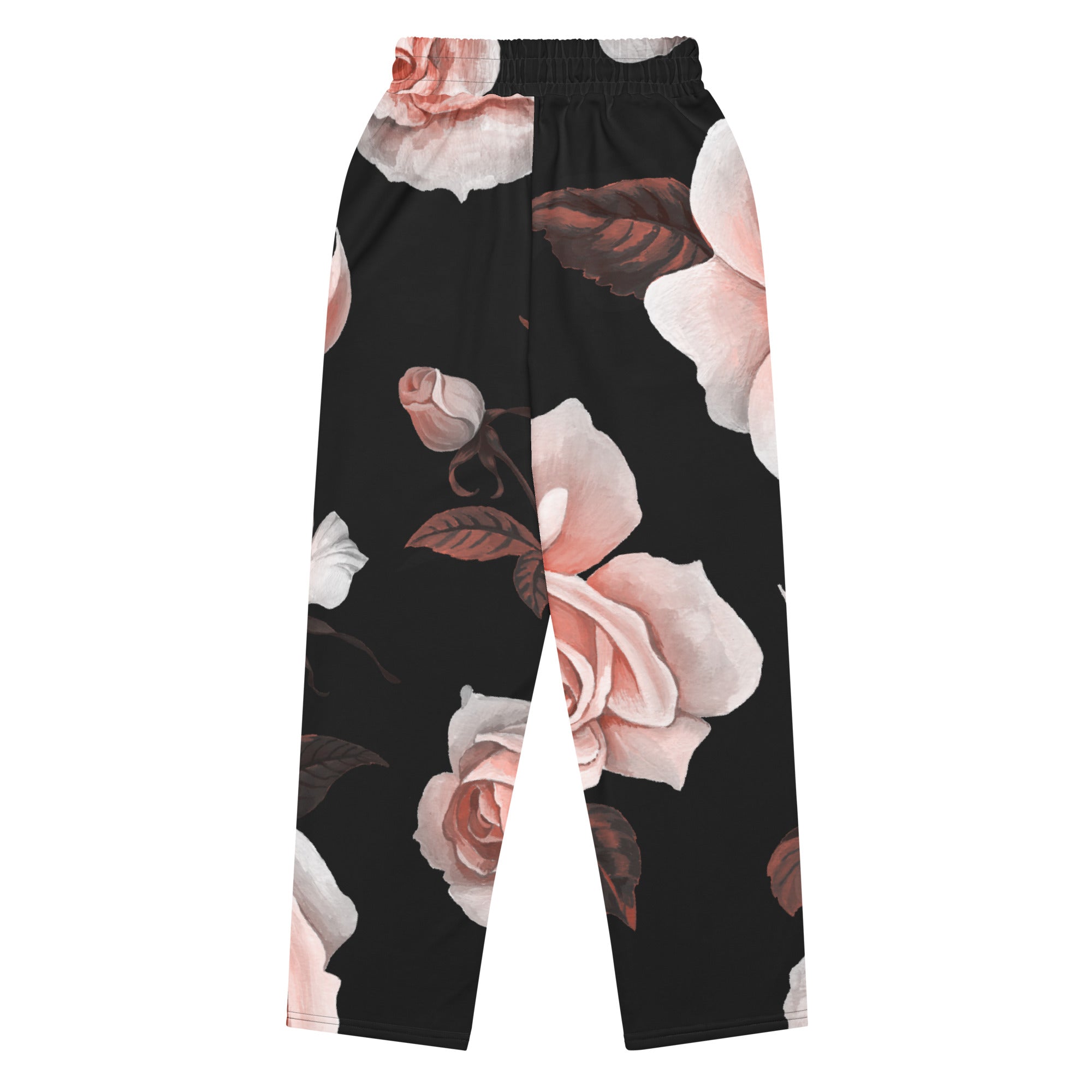 A close-up of The Paris Flow Wide Joggers, highlighting the detailed XL pale pink rose print against the black background and showcasing the soft, recycled polyester fabric texture.