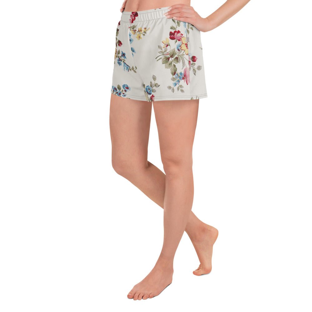 model wearing the Pink Blush Athletic Shorts, highlighting the delicate pink and sky blue floral print and the athletic 2.5″ inseam.