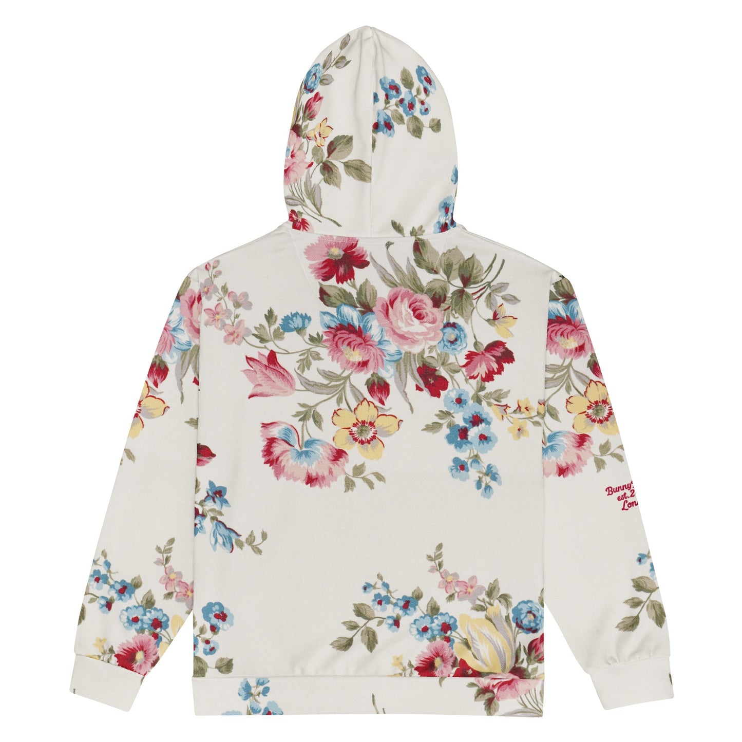 The Pink Blush Zip Hoodie, showing the serene pink blush and sky blue floral pattern and the premium fit with metal zipper details.