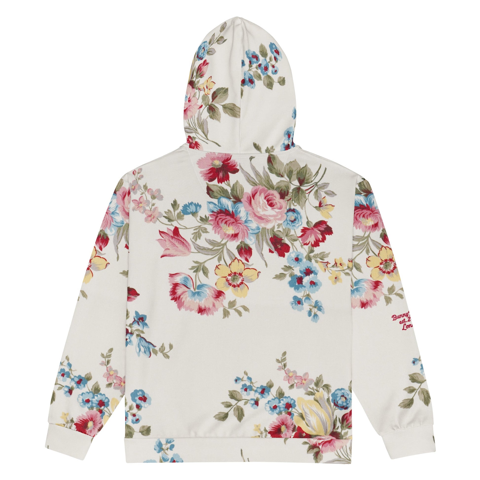 The Pink Blush Zip Hoodie, showing the serene pink blush and sky blue floral pattern and the premium fit with metal zipper details.