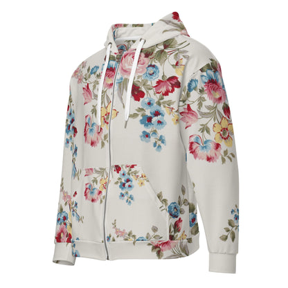 Close-up of The Pink Blush Zip Hoodie fabric, highlighting the textured, off-white base, the delicate floral print detail, and the soft texture of the 95% recycled polyester.