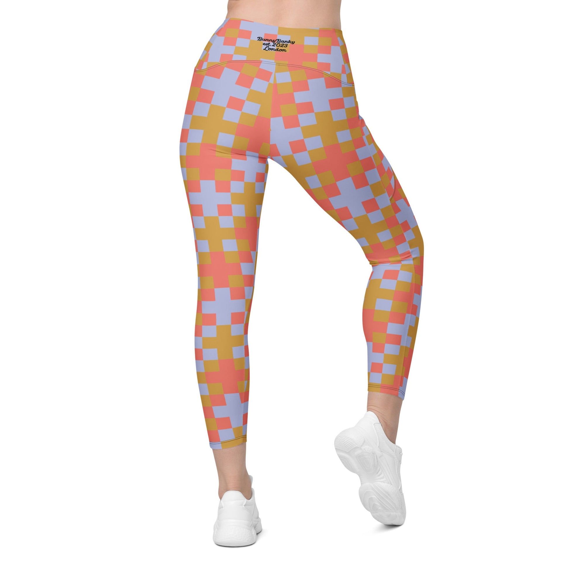 Back view of the Pixel Glam Sculpt Leggings on a  model, showcasing the flattering body-contouring effect of the geometric print and the secure, seamless fit of the high waistband.