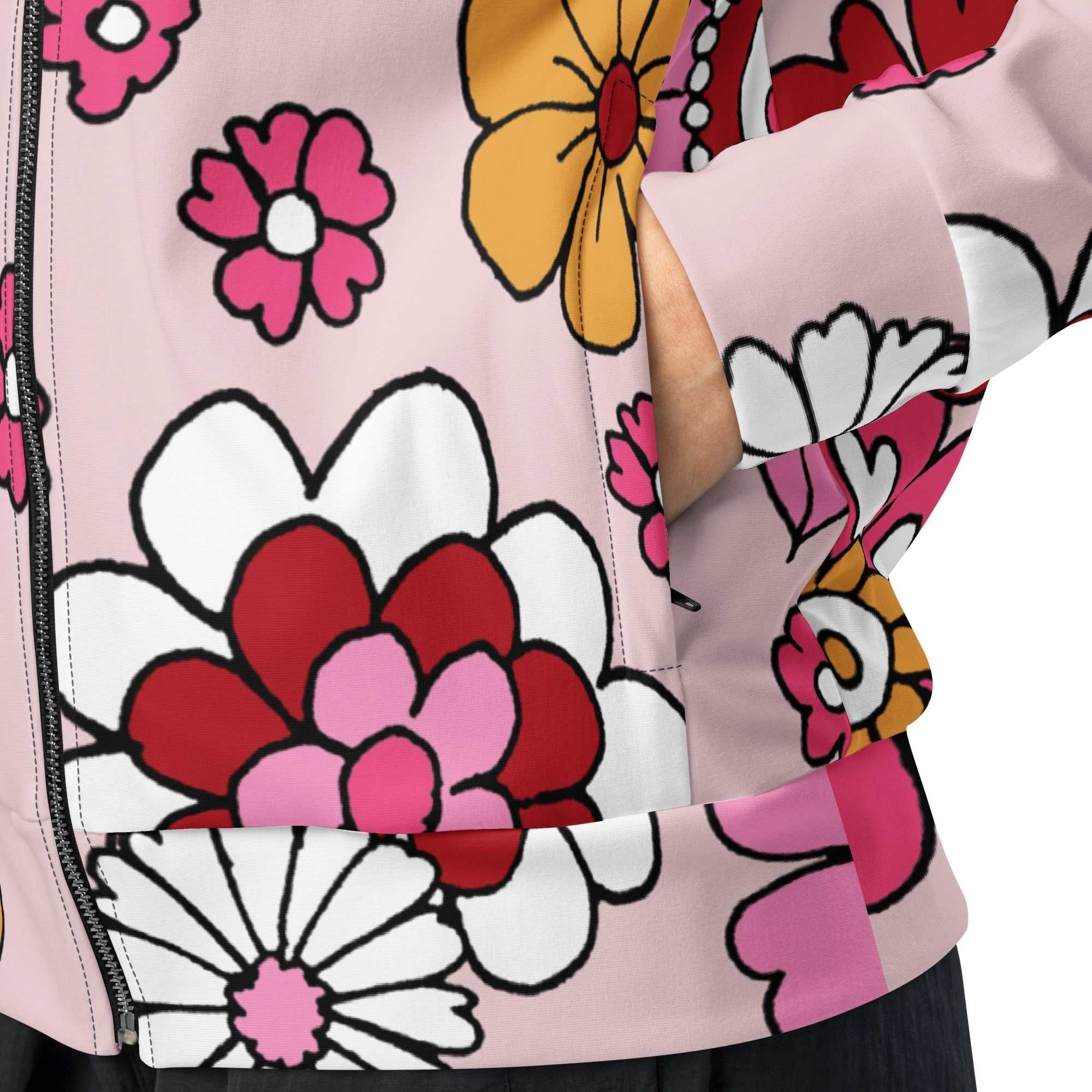 A close-up of The Primrose Hill Track Jacket's recycled polyester fabric, highlighting the texture and the intricate, oversized pink and yellow floral print detail.