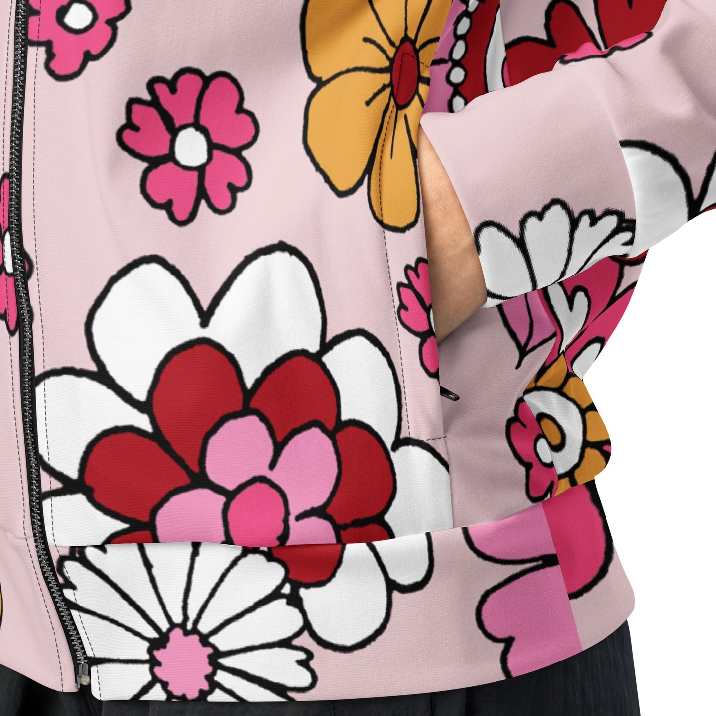 A close-up of The Primrose Hill Track Jacket's recycled polyester fabric, highlighting the texture and the intricate, oversized pink and yellow floral print detail.