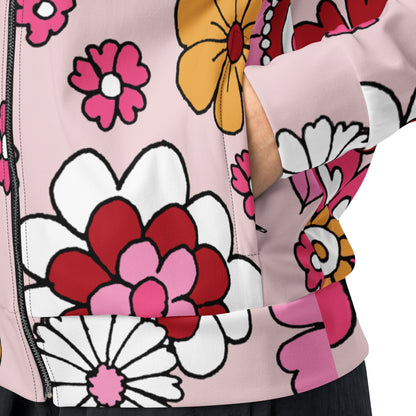 A close-up of The Primrose Hill Track Jacket's recycled polyester fabric, highlighting the texture and the intricate, oversized pink and yellow floral print detail.
