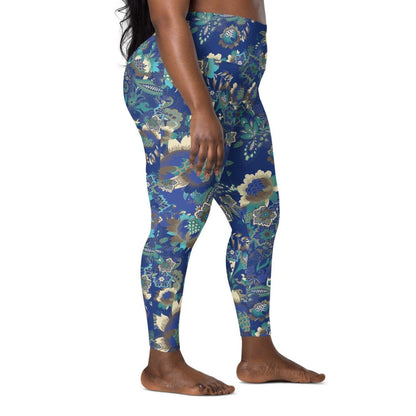 A model wearing the Rio Sculpt Leggings in the bright blue floral print, showing the flattering high-waisted fit and side pocket detail.