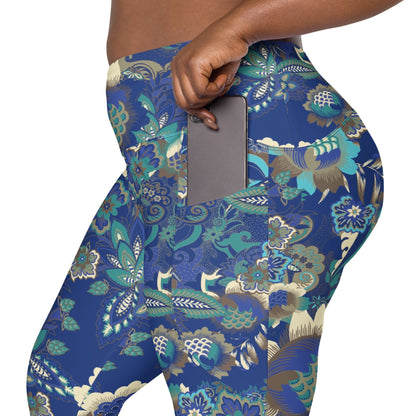 A model wearing the Rio Sculpt Leggings in the bright blue floral print, showing the flattering high-waisted fit and side pocket detail.