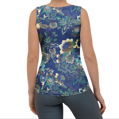 A woman modeling the rio performance tank. a sleeveless athletic tank top with a detailed botanical and floral pattern in navy blue, teal, and gold, paired with dark gray leggings, against a plain white background.