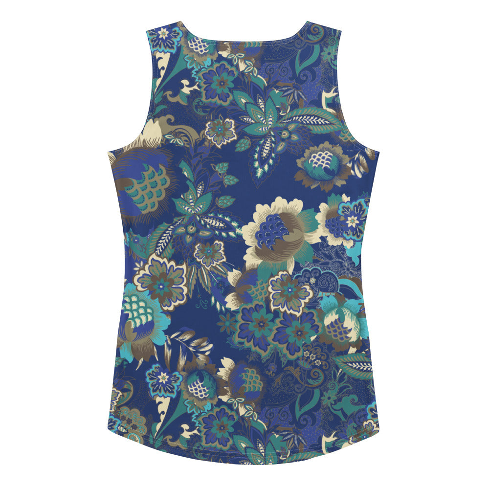 The rio performance tank. a sleeveless athletic tank top with a detailed botanical and floral pattern in navy blue, teal, and gold, paired with dark gray leggings, against a plain white background.