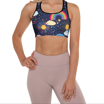A model wearing the Riverside Performance Bra showcasing the dreamlike print of clouds, stars and rainbows on navy blue background 