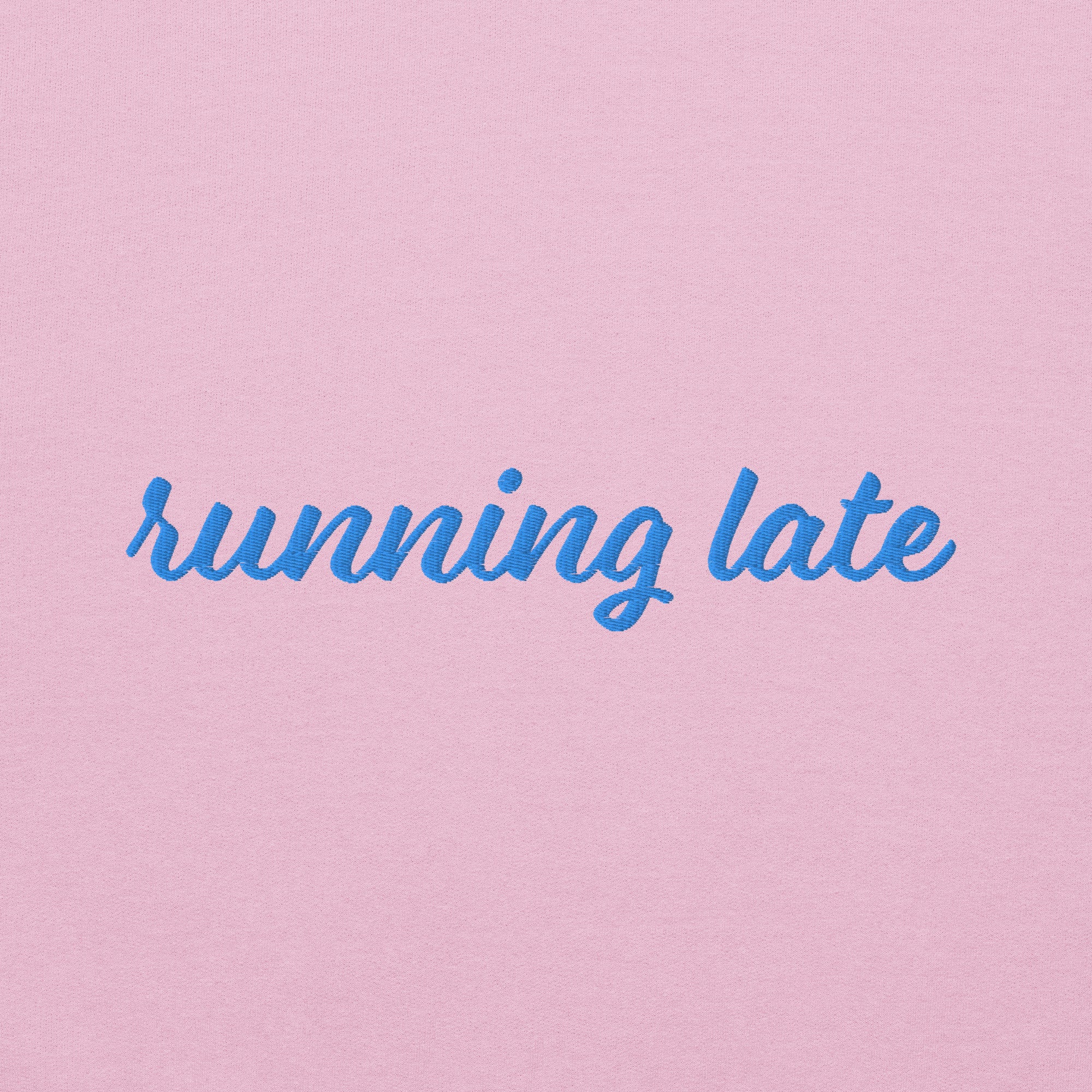 A close-up of The Running Late Sweatshirt, highlighting the 